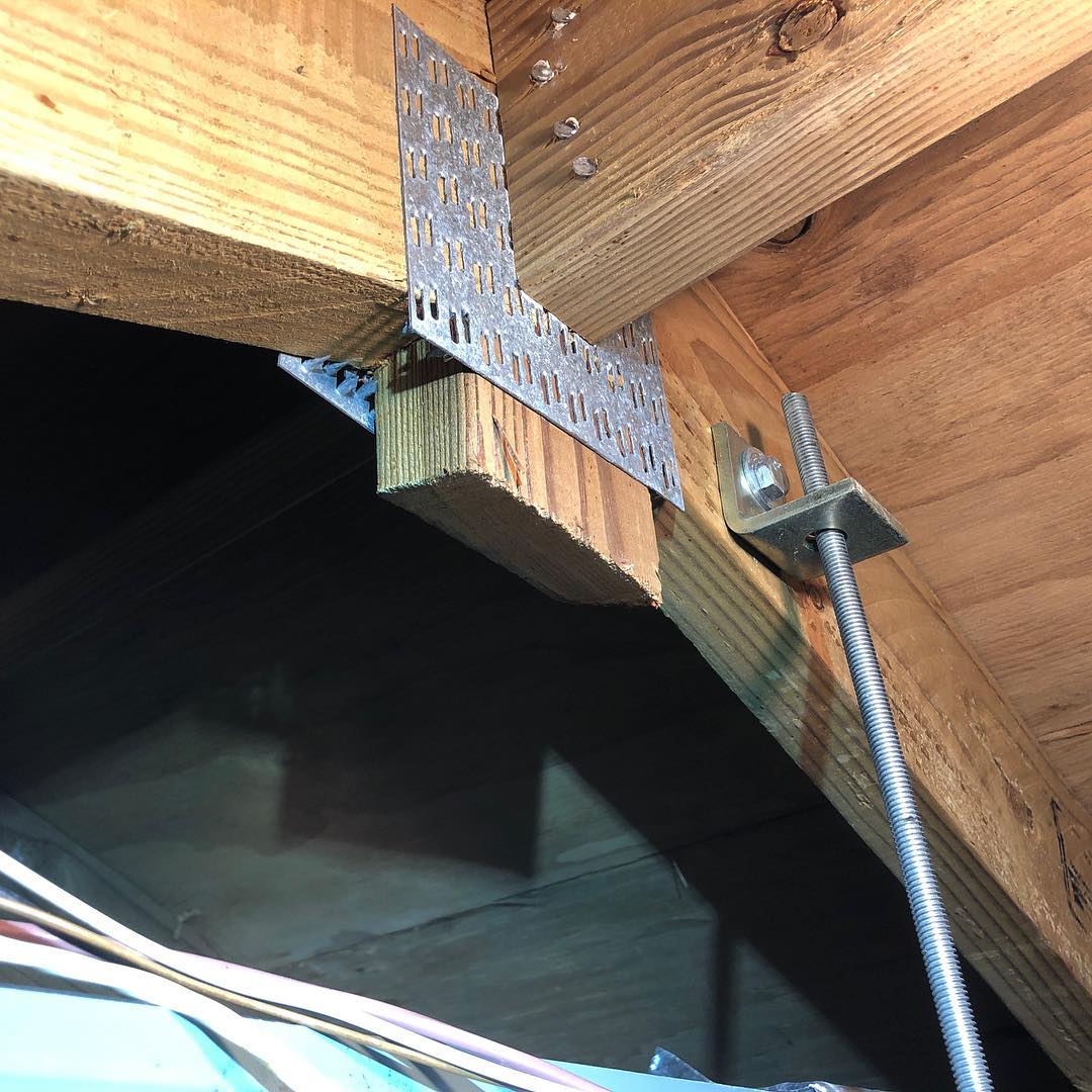 Cutting roof truss framing to fit in a central AC air handler is more common than you think. Check your contractors work.