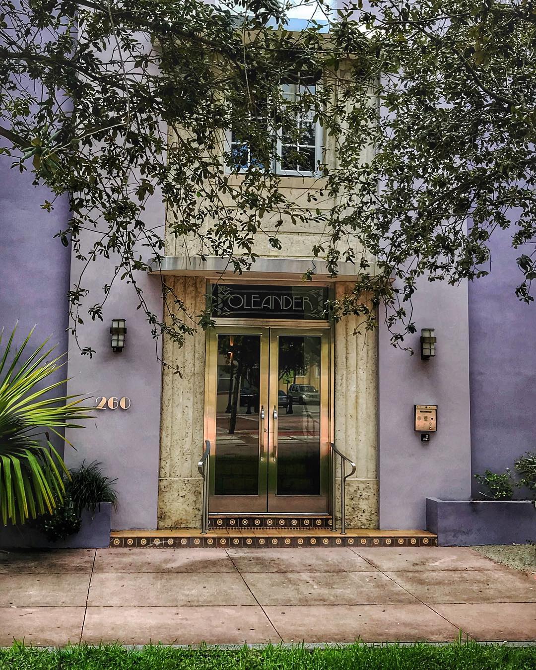 There aren’t that many design styles I can confidently indentify by name, but Art Deco I’ve loved since college {school project}. Miami Beach is an Art Deco heaven.
This purple lady isn’t one of the iconic beauties on Ocean Drive. She’s on a side street. I love that the brass numbers and light almost look like rose gold accessories from the reflection of the sun. And the tiles, with their perfect circles, remind me of a beaded necklace.