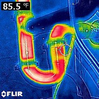 Reversed P trap under sink. This creates a deep trap, making debris more difficult to drain which leads to clogs. Thermal image shows how much water (red hot/water) sits in trap.
