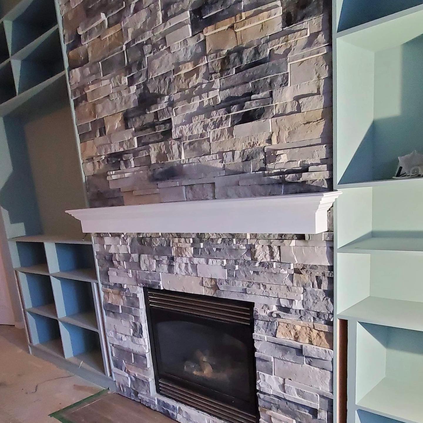 Check out the process pictures of this mantle. We first installed it to see what it looks like and the client asked us to cut the bottom off. Mitch had to fill the bottom in and repaint then re-install; this is the final product. 👌 Swipe right to see more images.