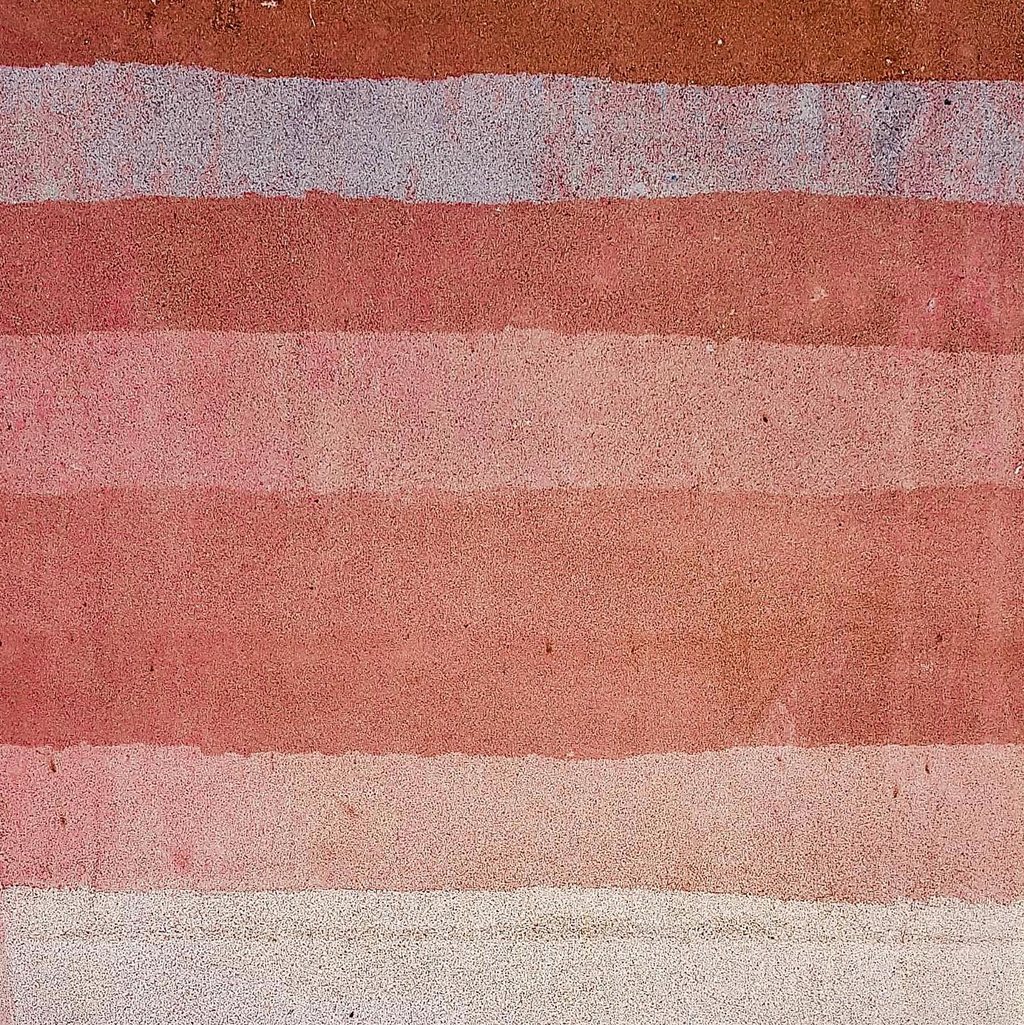 Photo of a rammed earth wall taken during a site visit.
Rammed earth walls are constructed by ramming a mixture of selected aggregates, including gravel, sand, silt and a small amount of clay, into place between flat panels called formwork.