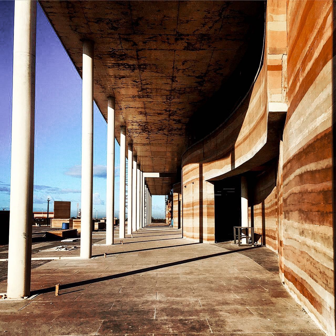 Photo of a rammed earth wall taken during a site visit.