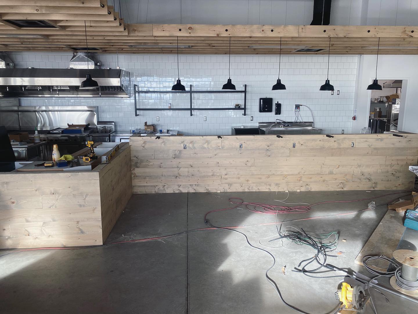 It has been absolutely crazy lately with jobs and deadlines. Here are some progress shots of a commercial job: shiplap wrapped counter — framed, treated with a grey washed stain/sealed, and installed. As well as a picture custom swing door I built — this is only a small taste; things are pulling together and @pitchforkmarketandkitchen is going to be a really cool place to visit at it’s grand opening tomorrow! Local food vendors stocking its market and being used in the kitchen, awesome place to have in Saskatoon.
.
.
.
.
.
.
#lawrencefinishing #localeats #restaurantconstruction #shiplap