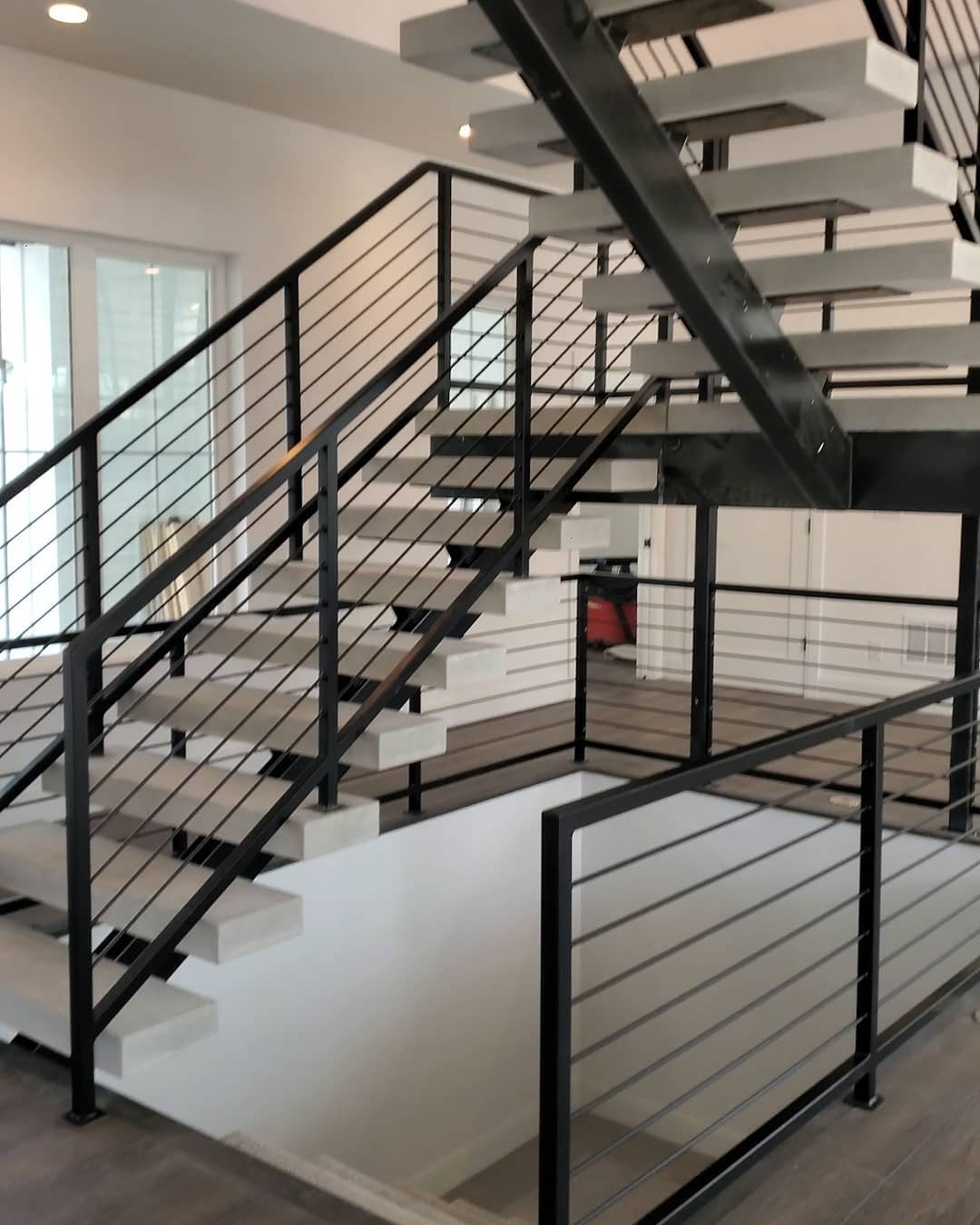 The fellas putting the finishing touches on this bad ass floating stair with 4" thick concrete treads. Thank you @carbonbuildsco for trusting us with your fabrication needs.