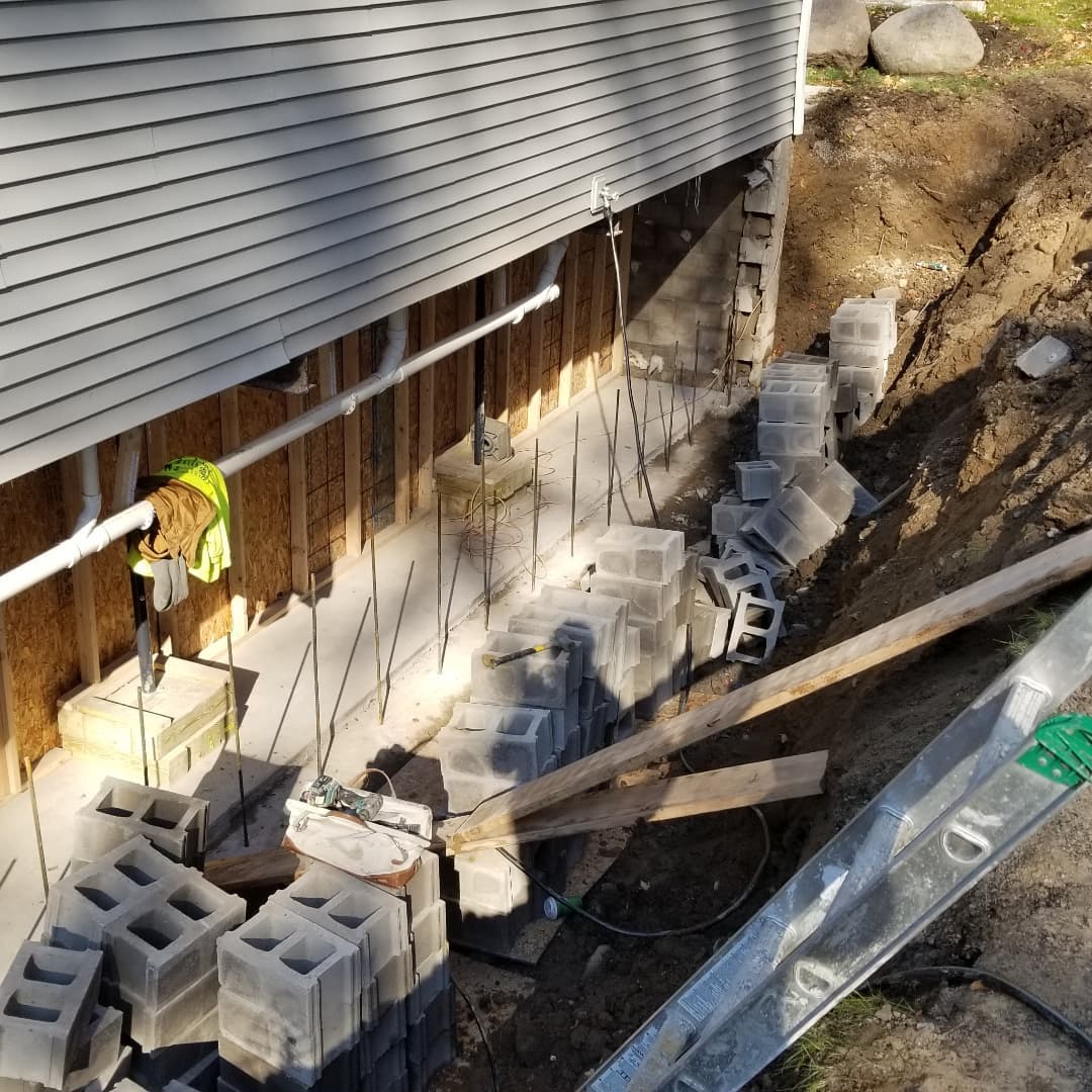Is it important to have steel reinforcement from the footing to the CMU wall base? Well, unless you want to have your basement wall collapse into the basement TWICE before installing it.... yes. Yes it is important.
Please don't cut corners, especially when the drawings show to install it