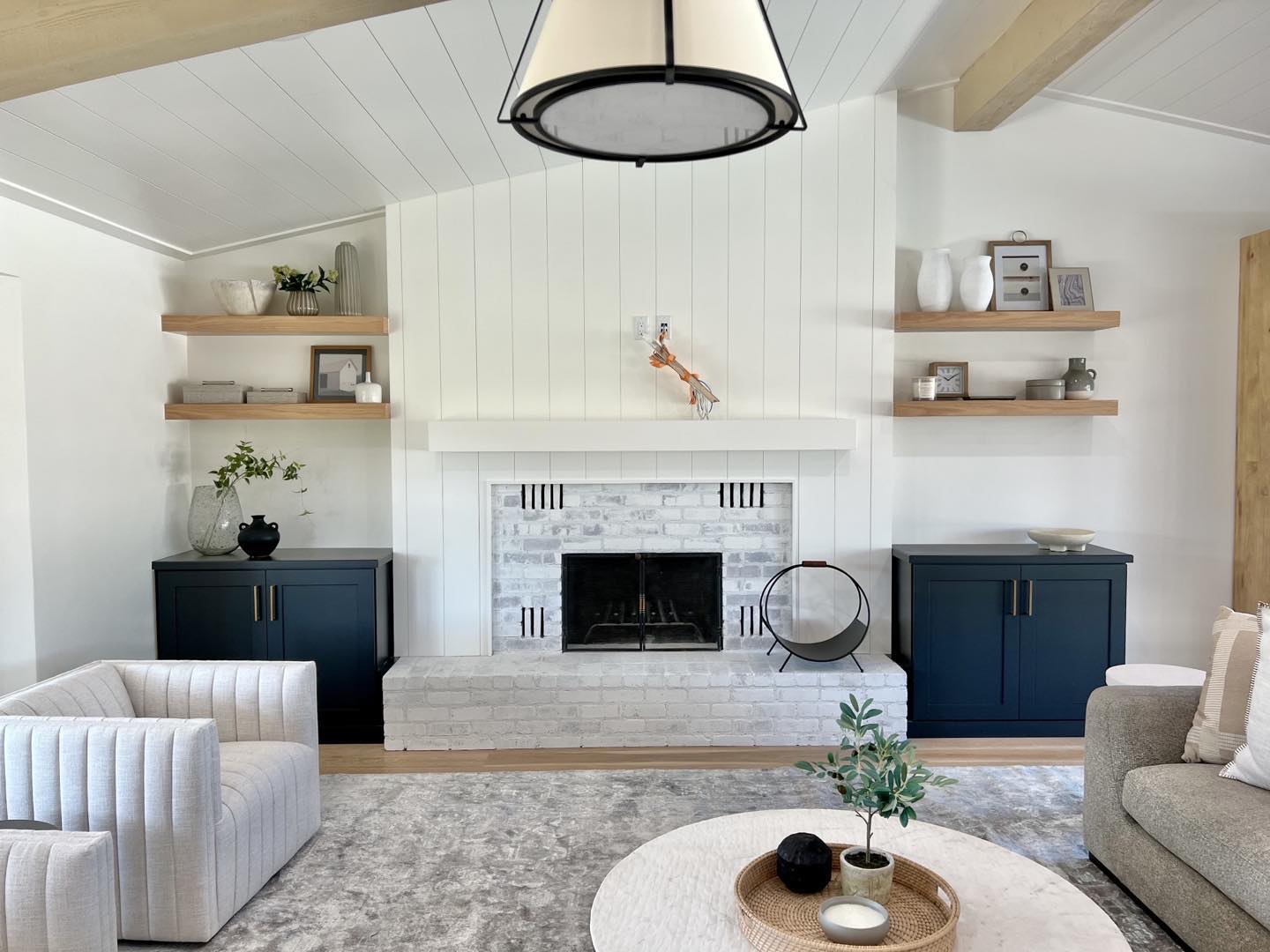 Winter is coming! (If you want to call it that in Arizona.) We love the extra storage next to the fireplace! Why not add some warmth and a little pop of color to your cabinets?! #fireplacecabinets #customcabinets #bluecabinets #interiordesign #cabinetdesign #beautifulcabinets #storagecabinets #cabinetry #cabinets