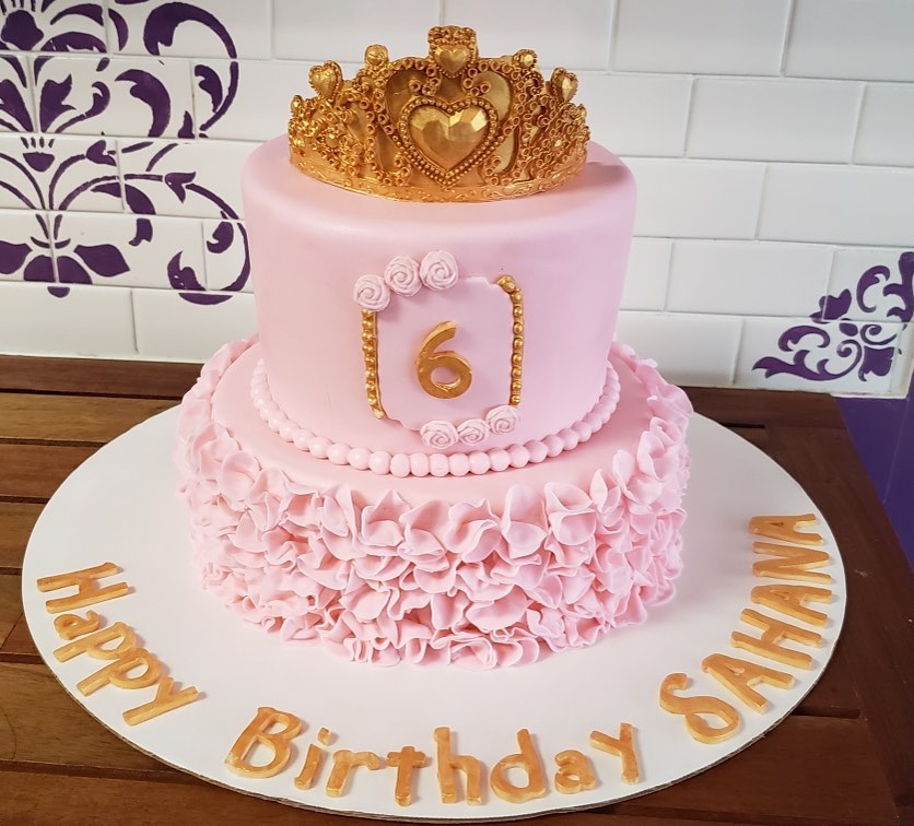 A two tiered vanilla and chocolate marble cake with 2 layers of dulce de leche inside, finished with Irish cream icing and fondant ! Happy birthday Sahana 🎂