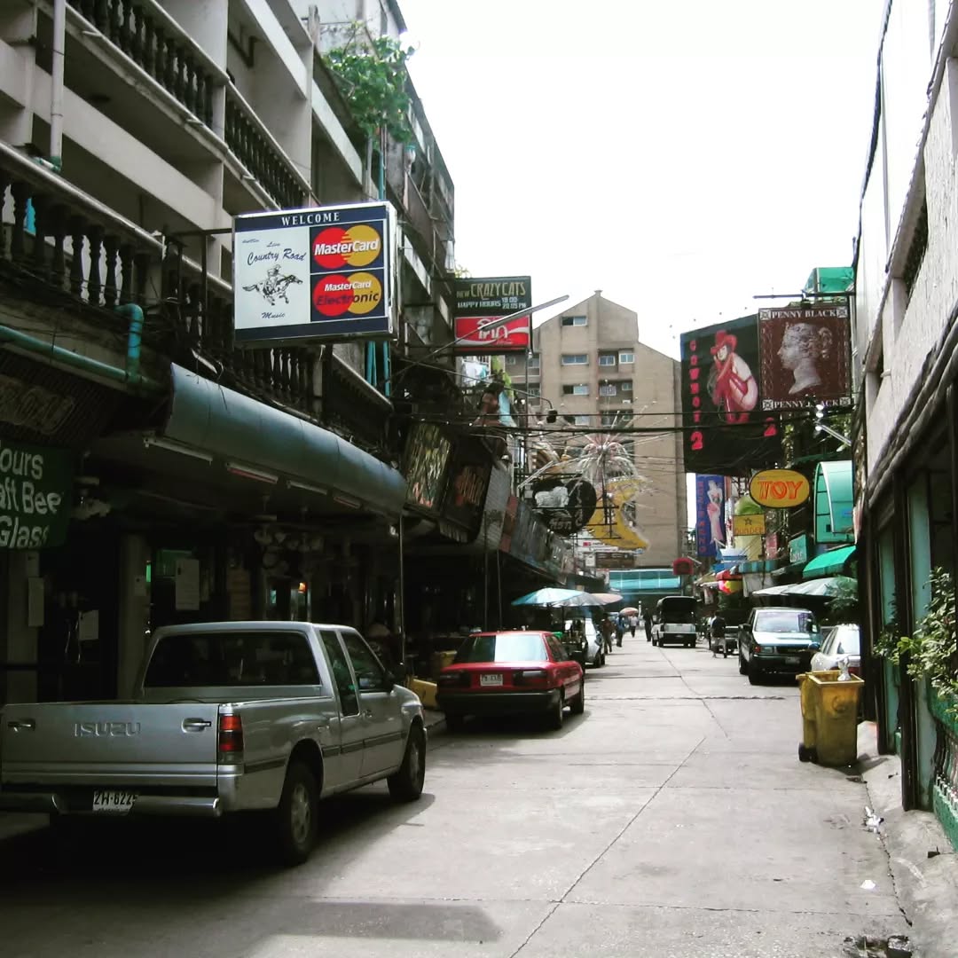 May 17, 2004 - Scenes from Travels in the Land of Hunger (page 166) by Domenico Italo Composto-Hart
.
Walking through the infamous Soi Cowboy
.
"Although prostitution was declared illegal in Thailand in 1960 under the Prostitution Suppression Act, the Entertainment Places Act in 1966, which provided legislation for the regulation of 'nightclubs, dance halls, bars, massage parlours, baths and places 'which have women to attend male customers' ' signaled that prostitution would be tolerated to an extent. Soon after, in 1967, during the Vietnam War, the U.S. government contracted Thailand to 'provide 'Rest and Recreation' (R&R) services to the troops.' Charles Keyes goes on to explain in his book Thailand: Buddhist Kingdom as Modern Nation-State that the presence of U.S. troops during the war 'helped create a new wealthy class in Thailand from among those people who held contracts for construction or service to the United States or the Thai military. It also contributed markedly to corruption in the military and police, as well as to a dramatic rise in prostitution, alcoholism, and drug use.' Thus by 1970, US military personnel (numbering up to 70,000 men) were spending in excess of $20 million."
.
#humantrafficking #humantraffickingawareness #endhumantrafficking #soicowboy #EducationNotExploitation #generationequality #equalitymodel #abolishmovement #polarisproject #southeastasia #backpackerlife #backpacking #backpackerstory #adventuretravel #travelwriting
#travelblogger #travelphoto #travelogue #travelblog #travelmemory #travelmemories #endsexslavery #travelsinthelandofhunger #thailand #thailandinstagram #thailandtravel #thailandtrip #endsextrafficking #endsextraffickingworldwide #equalnotexploited