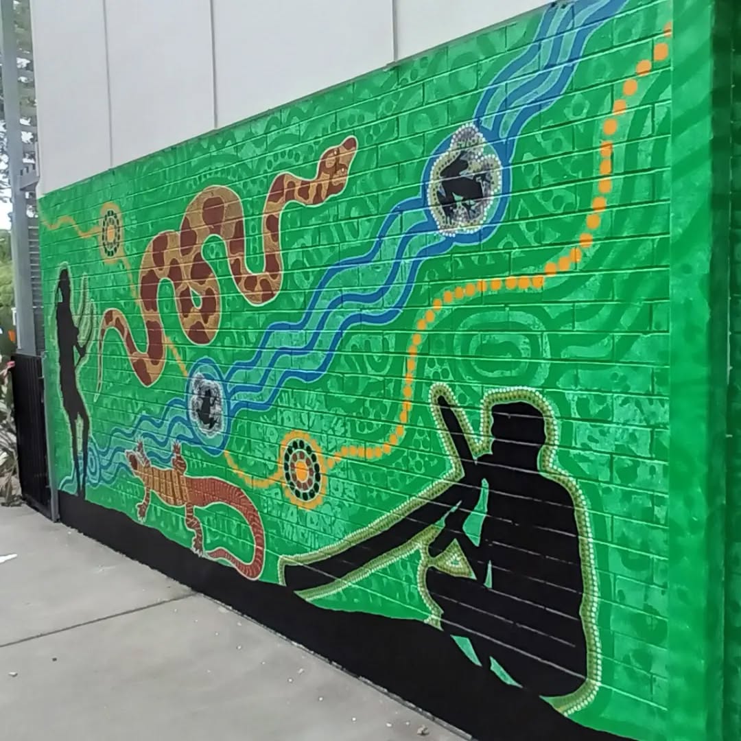 Durack State School mural. This mural represents the totems of the local tribes being Yagarra, Jaggera and Yurrapple people. It took 3 days to complete.