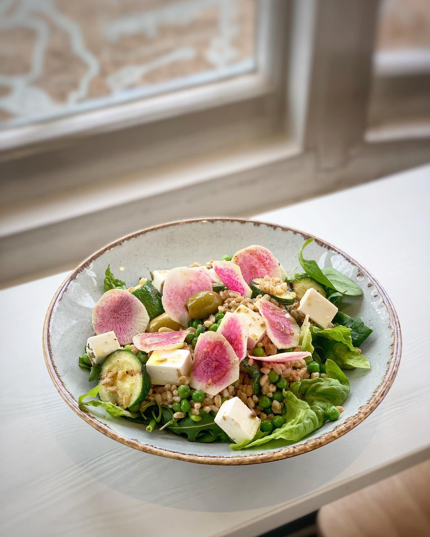 Utterly delicious and nutritious, here's the new salad on the menu at our park cafés: 'The Farro and Feta Green Spring Salad' with grilled courgette, peas, edamame beans, radish, salad leaves and house dressing.
Farro is an extremely nutritious grain because of its source of protein, fibre and nutrients (like magnesium, zinc and some B vitamins), add in all our green veg, top with beautiful, crunchy radishes and generous cubes of feta cheese - this salad should leave you feeling energised AND satisfied AND put a spring in your step!' 🤸🏽♂️🤸🏾🤸🏾🤸🏽♂️
🥗This is a vegetarian option
🍋 Our house-made dressing is zesty lemon, crushed coriander seed & mint
Currently on the menu @bishopsparkteahouse @therookerycafe @theskylarkcafe
#farrosalad #farroandfetasalad #farrograin #farrograinsalad #magnesiumrichfoods #zincrichfoods #healthysalad #springsalad #grilledcourgette #radishes #beautifulradishes #fetacheesecubes #newspringmenu #deliciousandnutritious #deliciousandnutritiousfood