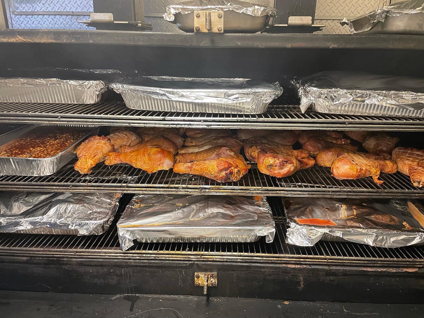 Nothing better than butts, breasts and legs on the smoker early in the morning. #bbq #spartanrace #charlotte