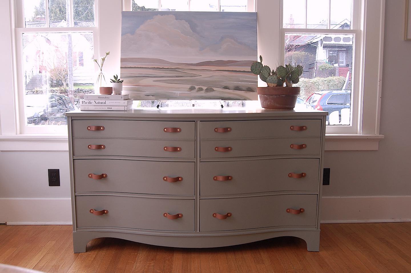 SOLD Such a pretty antique piece. Painted a beautiful sage green + leather pulls. Swipe for the “before” and see the full story at www.rachaelannart.com