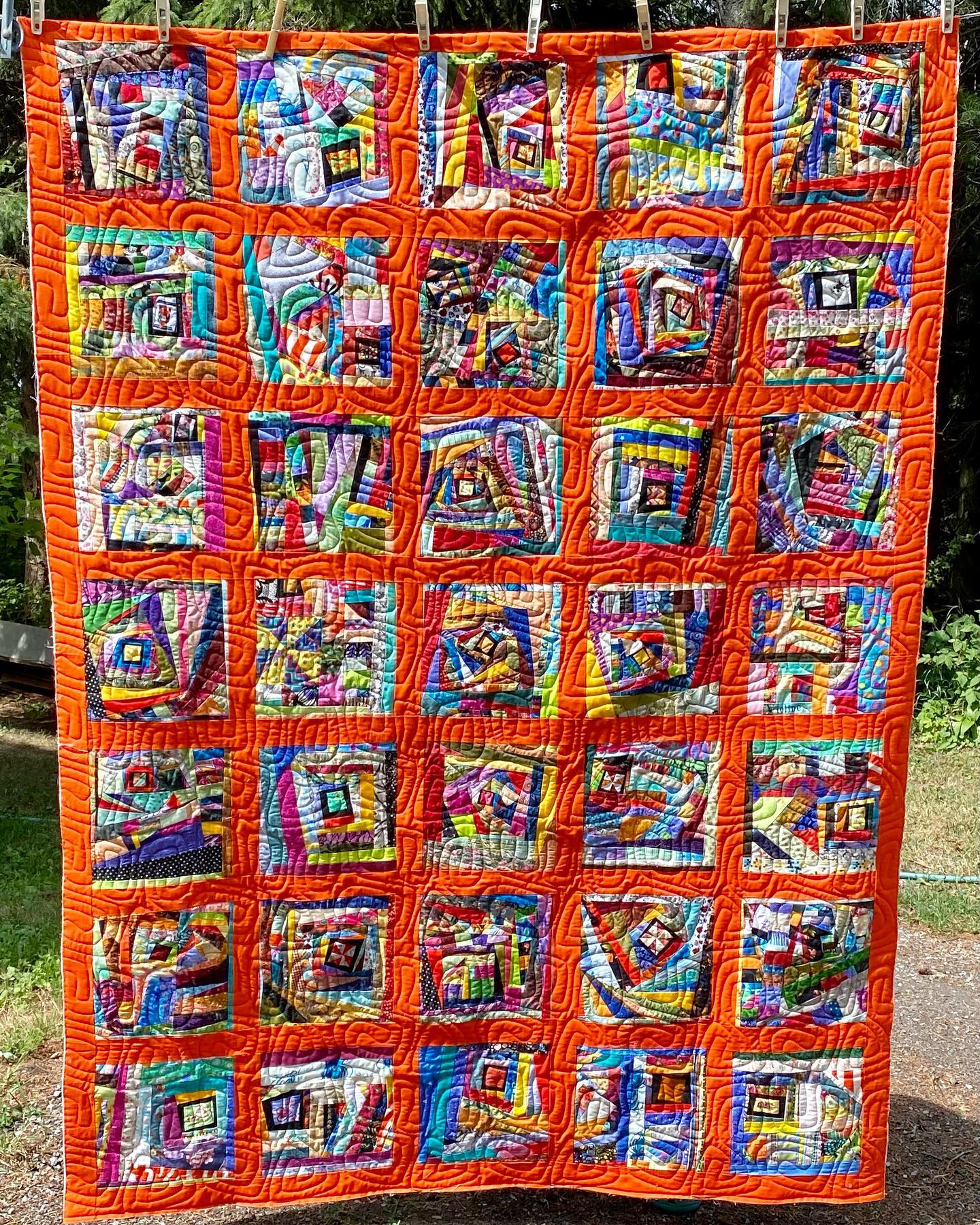 Just finished quilting a client’a a scrapilious “Orange Zest for Life”. See whole quilt and 2 details