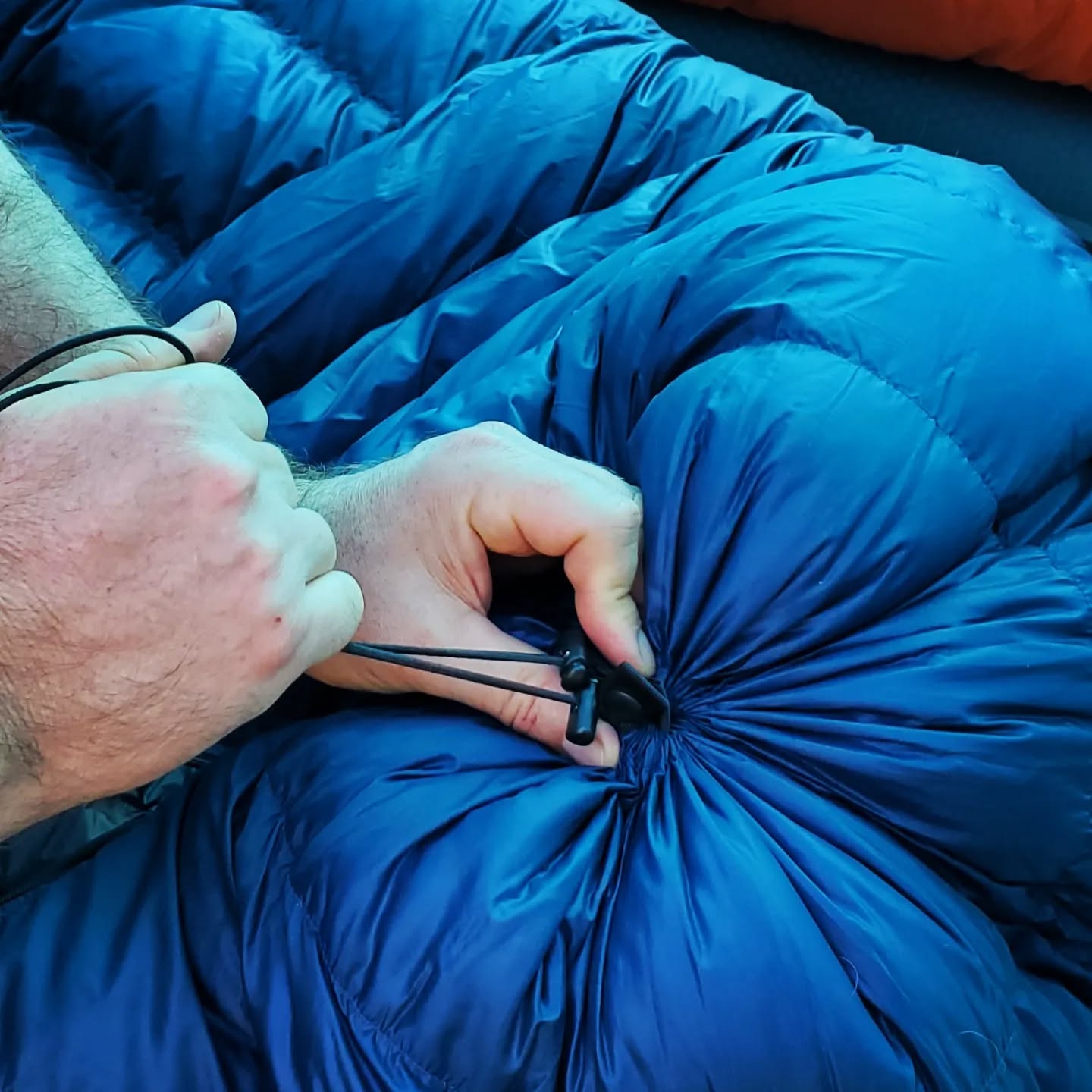 The versatility of a quilt with a zippered footbox is great, especially during these hotter months. The AlphaLite 900 uses a 24" YKK zipper for the footbox and a shock cord closure at the toe. This system allows you to seal it up tight if it's cold, open up just a bit to vent those warm feet, or unzip completely to use more like a blanket.
Always Handmade in USA 🇺🇸