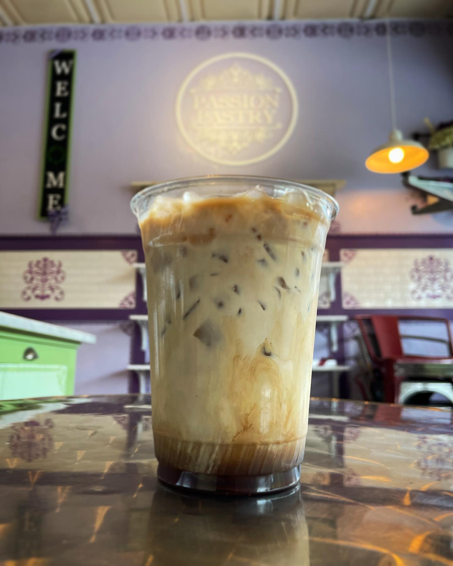 Come swing by Passion Pastry and try our freshly brewed coffee. Here we have our iced vanilla late that would go great with some pastries as well!