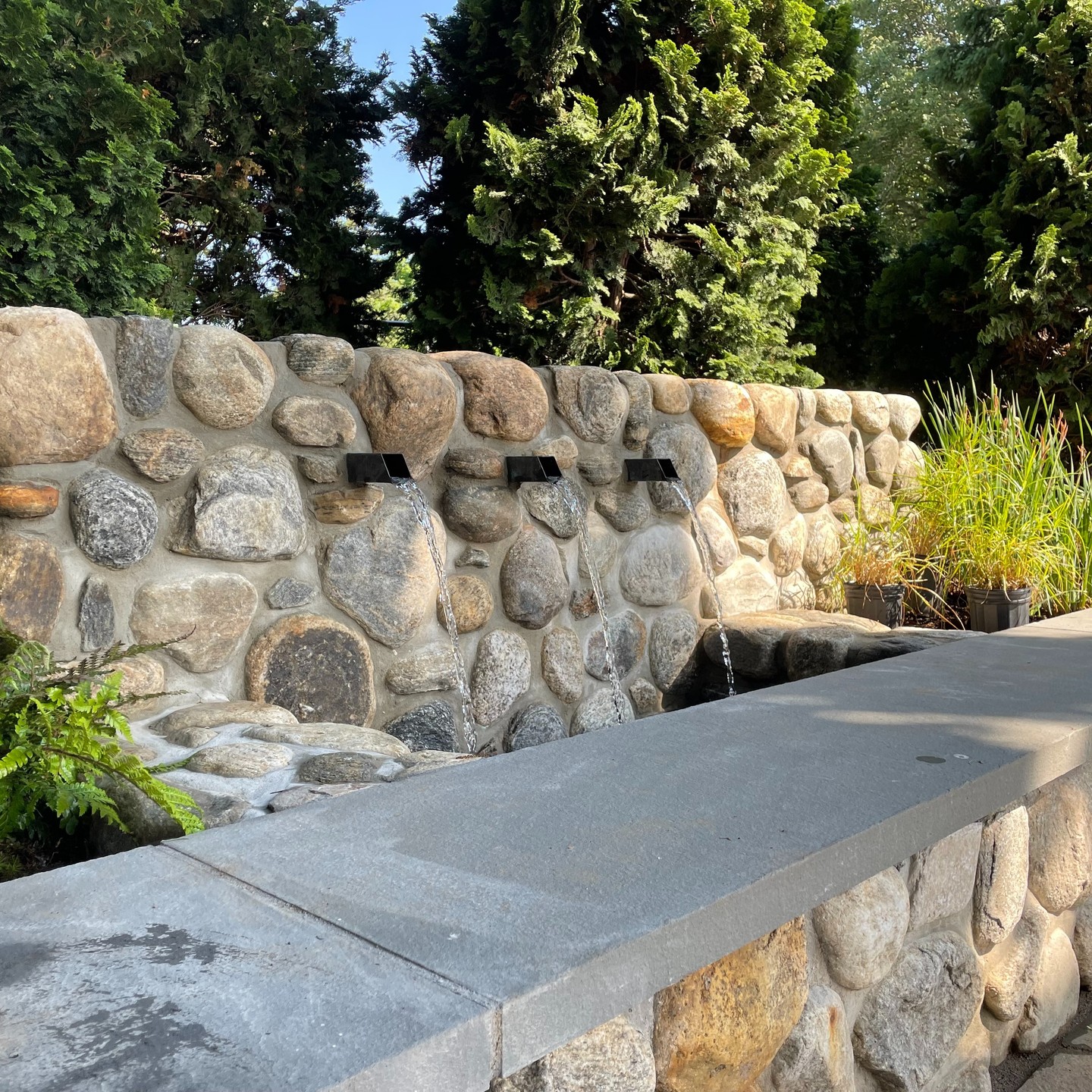 Hey Instagram, here we go!
For our first post, we wanted to share some in-process photos from Phase I of a project that was completed this past May. The existing boulder pile covered in cotoneaster was split and removed to make room for new seatwalls, an expanded bluestone terrace layout to improve functionality, a water feature to mask summer traffic heading to the Watch Hill beaches, and new plantings of natives and ornamentals to bring out the calm, Zen feeling the space was aching to express with its stunning Japanese maple existing on site. Perfect for fires in the evening or remote work during the day. Phase II begins when the pool house is complete!
Landscape Contractor: Moyer's Landscaping
Architect: Penniman Architects & Seabird Architects
Landscape Architect: Triplett Design Studio & Anne Penniman Associates
Project begun while at Anne Penniman Associates.
#landscape #landscapedesign #landscapearchitecture #landscapelovers #garden #gardens #gardeninspo #gardeninspiration #gardendesign #gardensofinstagram #rhodeisland #gardensofrhodeisland #watchhill #luxurygarden #waterfeature #masonry #perennialplants