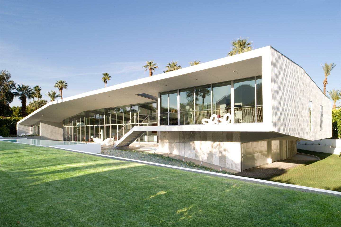 One of our favorite projects, we custom-designed the skin to wrap around the Desert Canopy house. The wall of windows was a deliberate move to capture mountain views, the canopy helps protect them from the harsh sun of Palm Springs. See more at: https://www.sander-architects.com/desert-canopy-house
.
.
.
#architecture #architect #design #construction #facadedesign #facade #architecturephotography #architecture_hunter #archdaily #nextarch #architecturelovers #home #homedesign #hybridhouse #hybridconstruction #desertcanopyhouse #arquitetura #perspective #pattern #archlife #netzero #palmsprings #palmspringsmodernism #residentialarchitecture #sanderarchitects