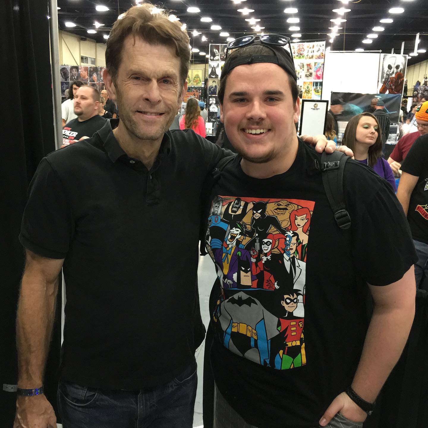#RIP #KevinConroy Who says never meet your heroes?
This is going to be a hard one. Yesterday, the world lost a pop culture legend - the voice of Batman - Kevin Conroy, aged 66.
Kevin began voicing the character in 1992 in the Emmy winning BATMAN THE ANIMATED SERIES. I spent countless days and nights watching the show with my dad growing up. In the last 30 years, Kevin continued the voice for countless series, a theatrical film, the amazing Batman: Arkham video games. The list goes on. In December 2019, droves of fans like myself eagerly waited in front of the TV to see him make his live action debut as a chilling, completely unhinged version of the character in an episode of “Batwoman.” The guy is a legend.
In 2015, I had the pleasure of meeting him at a Wizard World convention. If you’ve ever been to a convention, or at least seen the clichés, you know that you’ve definitely got some pop culture celebrities who whisk you through their line to collect as many dollars as possible. Being the voice of a generation, Kevin *always* had a line, but the guy was gracious, and took his time with every person who came to see him. When it came time for us to step up, my dad and I were able to tell him how much his work meant to us as fans and also to our relationship as father and son. Kevin was genuinely interested and moved by what we had to say, and rather than simply nodding and saying thank you and moving along, engaged in a full fledged conversation about his work, his latest Batman project, and meeting people like us. After our 5 or 7 minutes chatting with Kevin and he had signed the poster and movie I’d brought, he was happy to take a picture with me. I think we were all prepared to happily move along after that. But instead, *Kevin*, on his own, said “Randy, let’s do a picture too.” And then he said we should do the whole family. He took his time. He wanted to make everyone smile. And this is while there are lots of people waiting behind us to give him more money. (1/3)