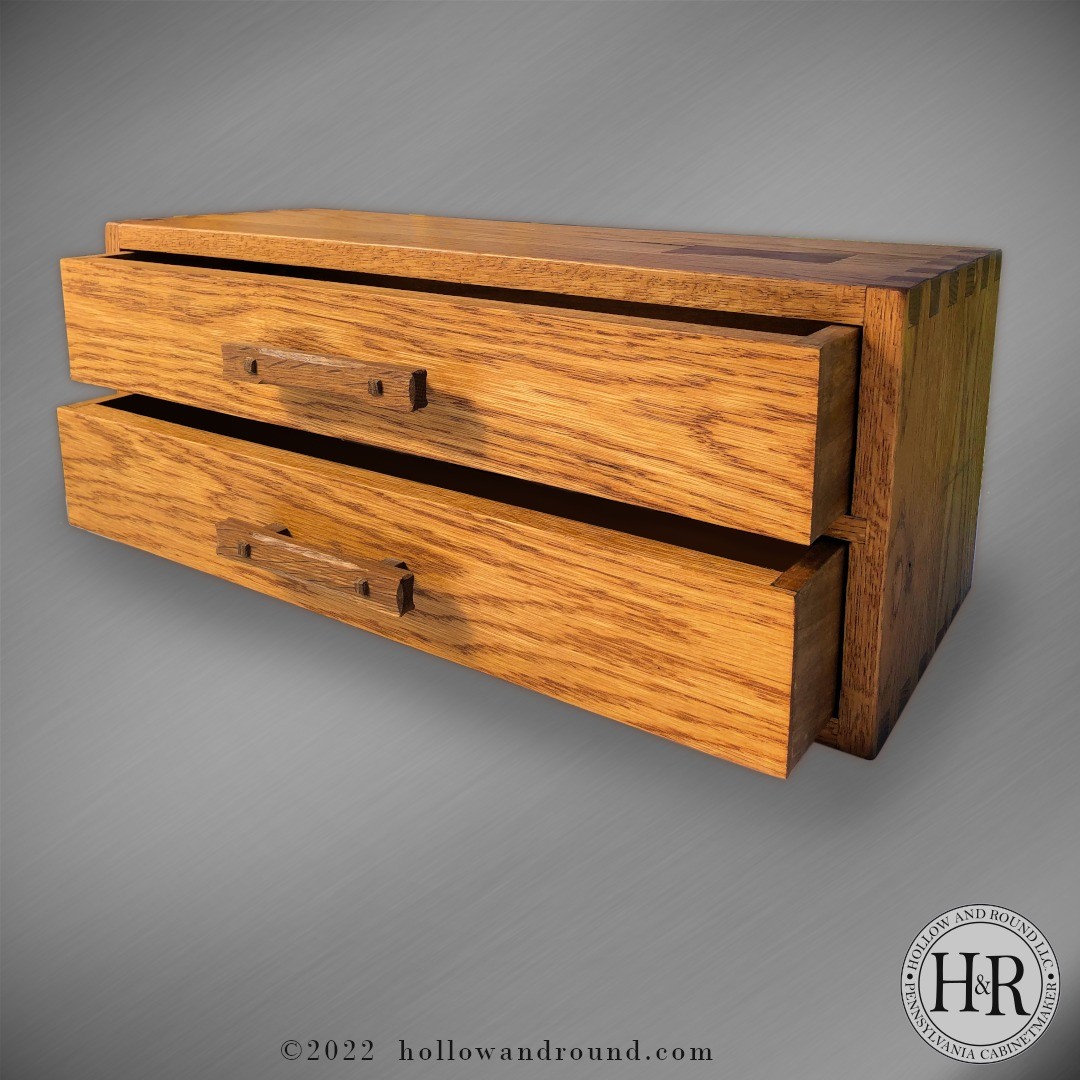 Another White Oak project, this one for cross stitch floss. I fumed the handles, carved some detail to them to soften them a little. The through tenons were wedged and provided a solid attach point. I did a vertical shiplap back and finished the whole thing with Danish Oil and about 5 coats of wax.