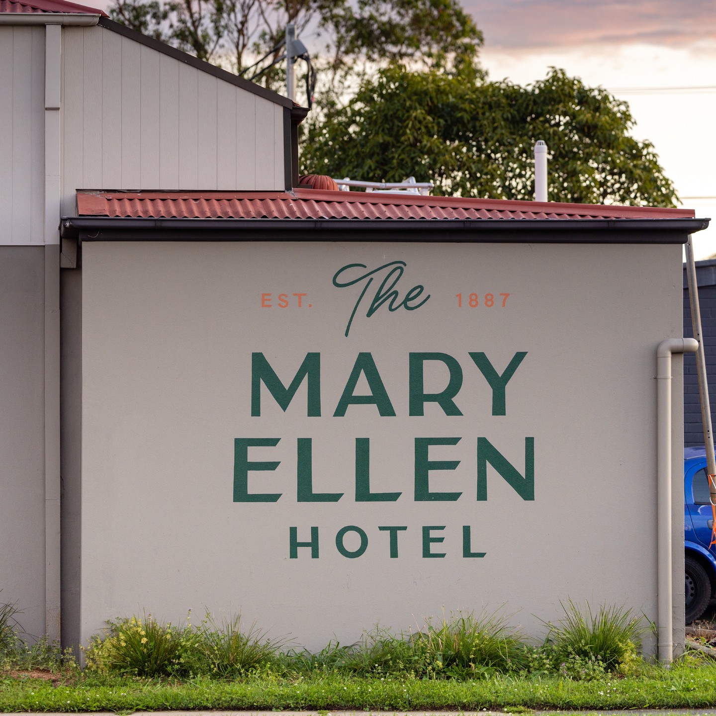Hand painted Mary Ellen logo, under awning, VIP and wayfinding signage.