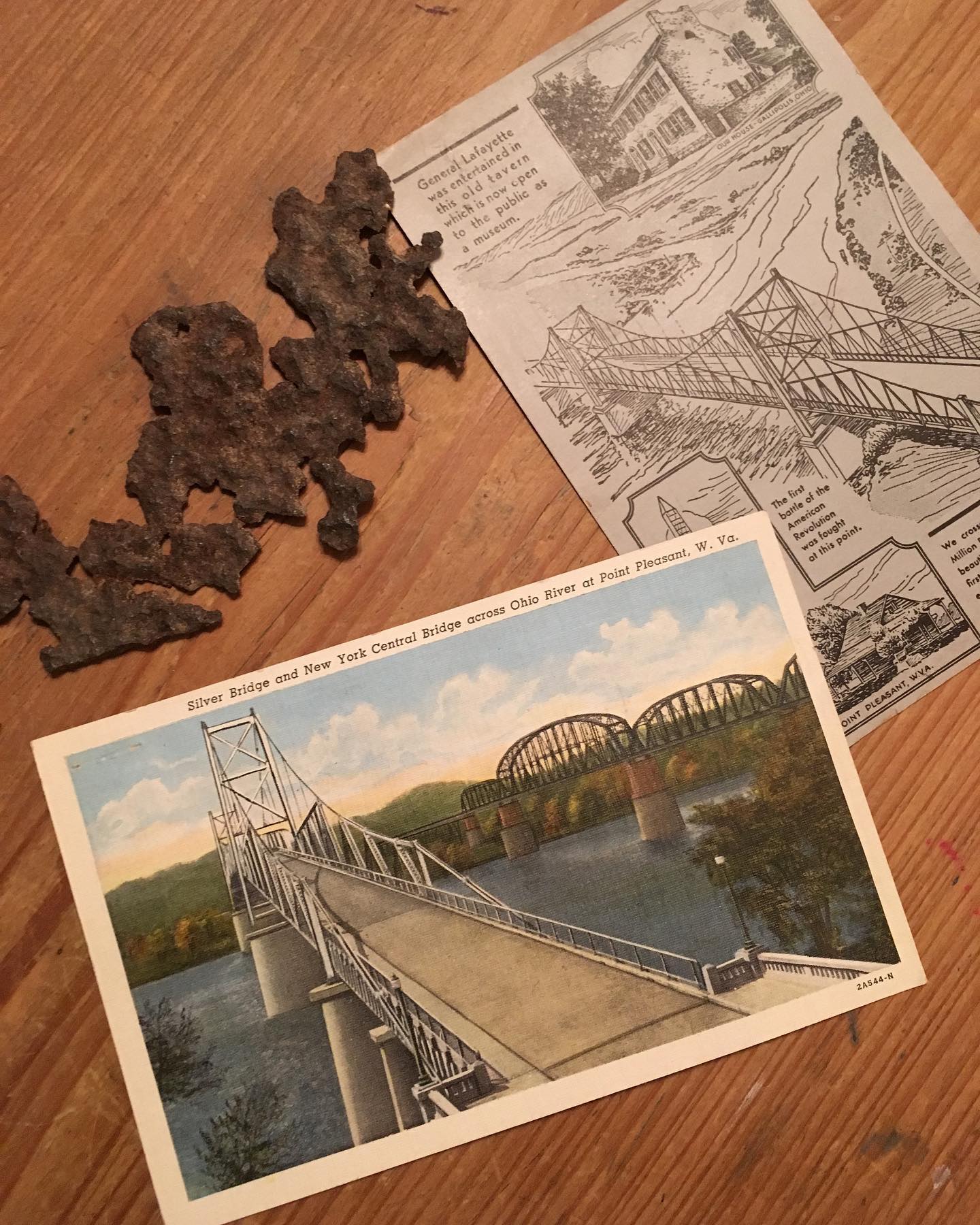 55th anniversary of the Silver Bridge Collapse Point Pleasant, WV
December 15, 1967
At approximately 5:00 EST a crack in one of the eye bar links that supported the bridge failed causing a chain reaction and toppling the 31 bumper to bumper vehicles packed on the bridge into the icy maw of the dark Ohio River. 67 people were knocked off the bridge most into the cold waters along with their vehicles. 21 would be rescued and 46 would perish. 44 of the victims who lost their lives would be recovered, the bodies of Kathy Byus and Maxine Turner were never recovered.
The events of this evening would rip apart a community and leave a lasting impact. In a twist of irony the bridge collapse would become synonymous with the legend of the Curse of Chief Cornstalk and mysterious bird like creature today known all over the world as Mothman. In reality the events of the Mothman continue to this day and had little to nothing to do with the events of the bridge collapse. Gray Barker and John Keel who both wrote period books on the strange events in Point Pleasant both used the bridge collapse as an exit strategy on their books. Hollywood would follow suit in the 2002 screen adaptation with the bridge collapse being the climactic ending.