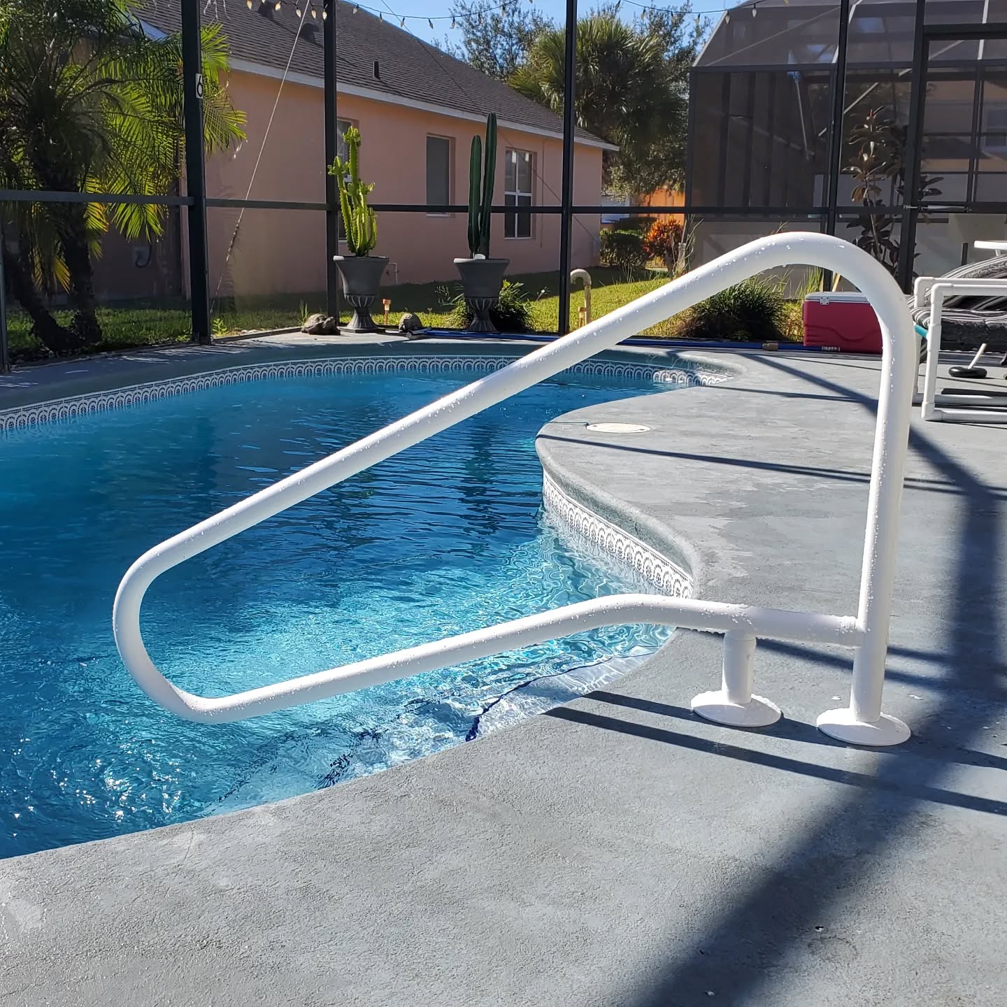 Handrails. Polymer coated stainless steel. They won't tarnish but will stay cool in the summer sun.