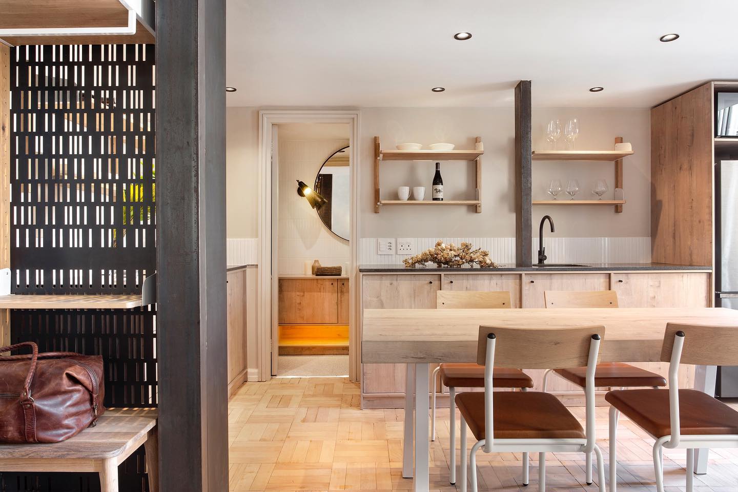 SOFT RUSTIC ELEGANCE
The simplicity and beauty of Rustenburg Granite, one of South Africa’s most popular stone countertop choices for decades now cannot be undermined.
Mined in Rustenburg South Africa, this is an extremely dense material and is well suited to high traffic areas as it requires little to no maintenance.
Rustenburg presents a overall dark grey colour with black and sometimes cream coloured flakes which vary slightly from batch to batch. It adds an effortless elegance to any environment with its uniform pattern and is available in a leather finish, as seen in this instalment.
The leather finish offers a smooth and velvety touch, a sensual experience which visually presents a somewhat opaque appearance; perfect for a softer, more natural aesthetic.
This gorgeous kitchen designed and fitted by KITCHENE is a timeless example of Rustenburg’s versatility in an interior.
Paired with charcoal black accents and a plethora of exposed wood cabinetry in warm, creamy tones our teams instalment of Rustenburg Granite Leathered countertops stand to create subtle contrast whilst providing timeless durability and a soft, rustic and elegant aesthetic.
Featured in Mutual Heights, Cape Town City Centre, we are grateful for this collaboration between our team at Rock & Stone and @kitcheneza
Well done on a stunning job!