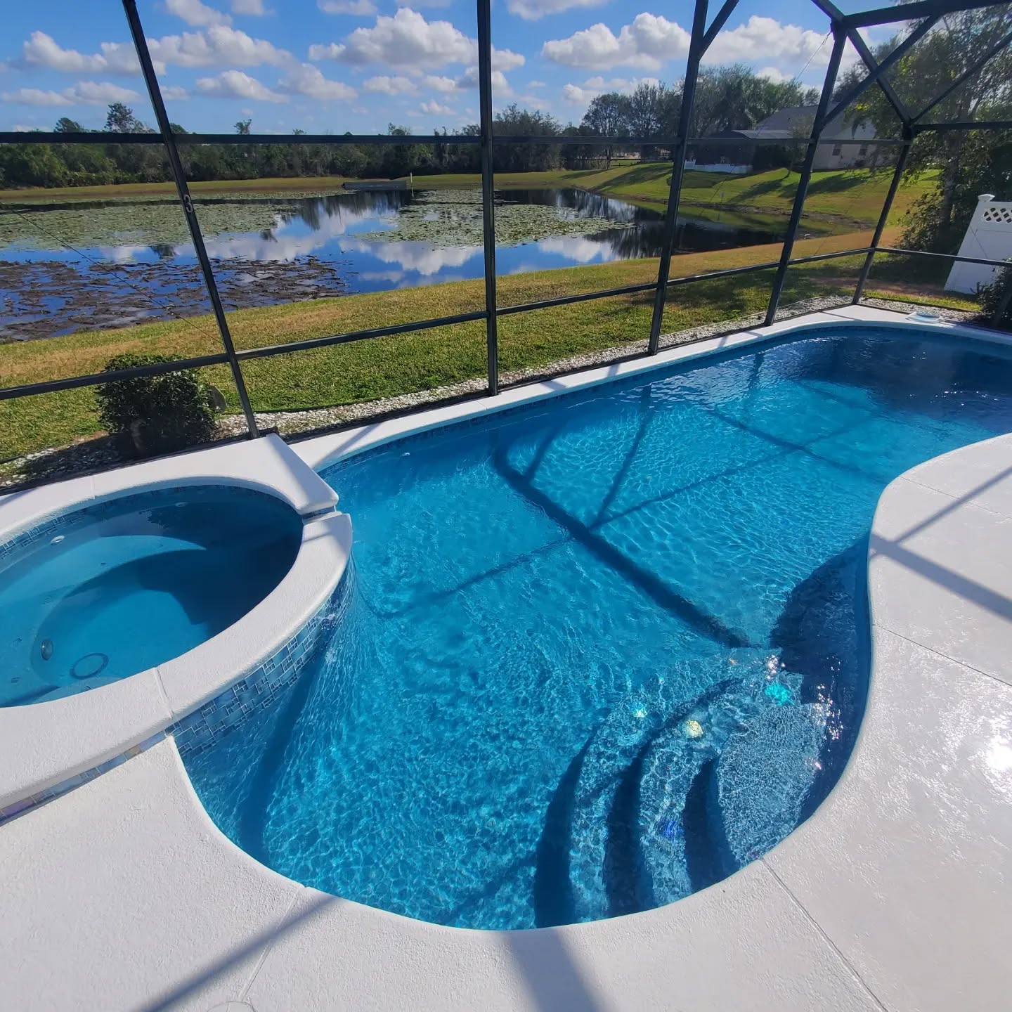 Glass Mosaic Tiles, Aqua Pearl Pebble Finish, and Fusion Mosaics on the steps at this Pool-Spa Home!