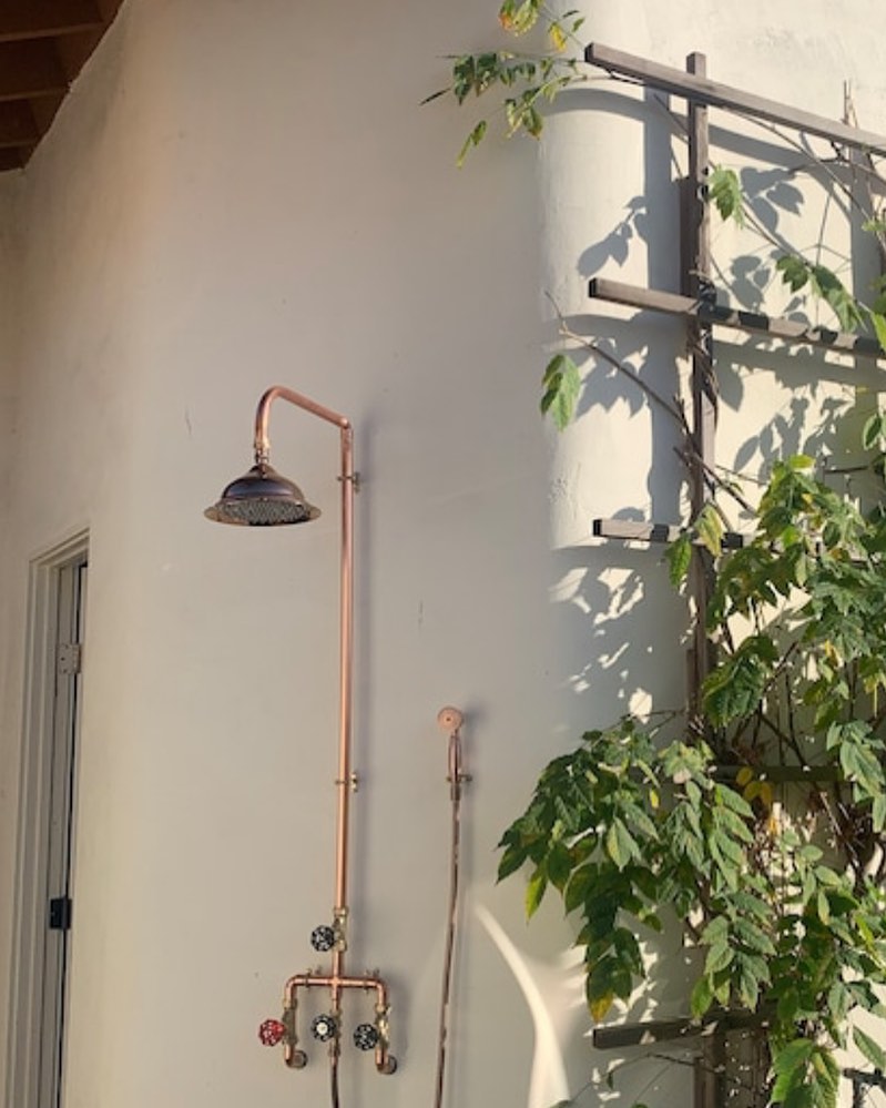 For the love of the great outdoors. Some time ago I was asked by a customer in California who wanted an outdoor shower he couldn’t get off the shelf. So happy to be able to help him with this handmade piece. And even though I loved the look of it in my workshop in Somerset, I think it looks even better in its new home a few thousand miles away. #bespokebathrooms #artbathroom #copper #coppershower #copperradiator #coppertaps #coppertowelrail #custommade #handmade #outdoorshower #gardenshower