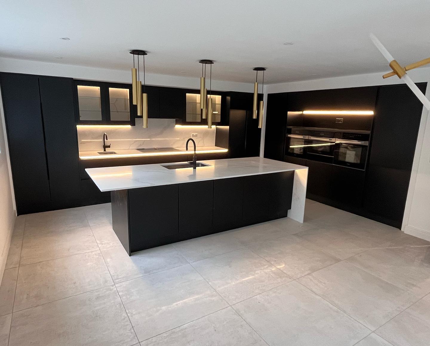 Back to Black. Stunning combination of bespoke painted slab Cosdon by Multiwood with Calacatta Gold Quartz.