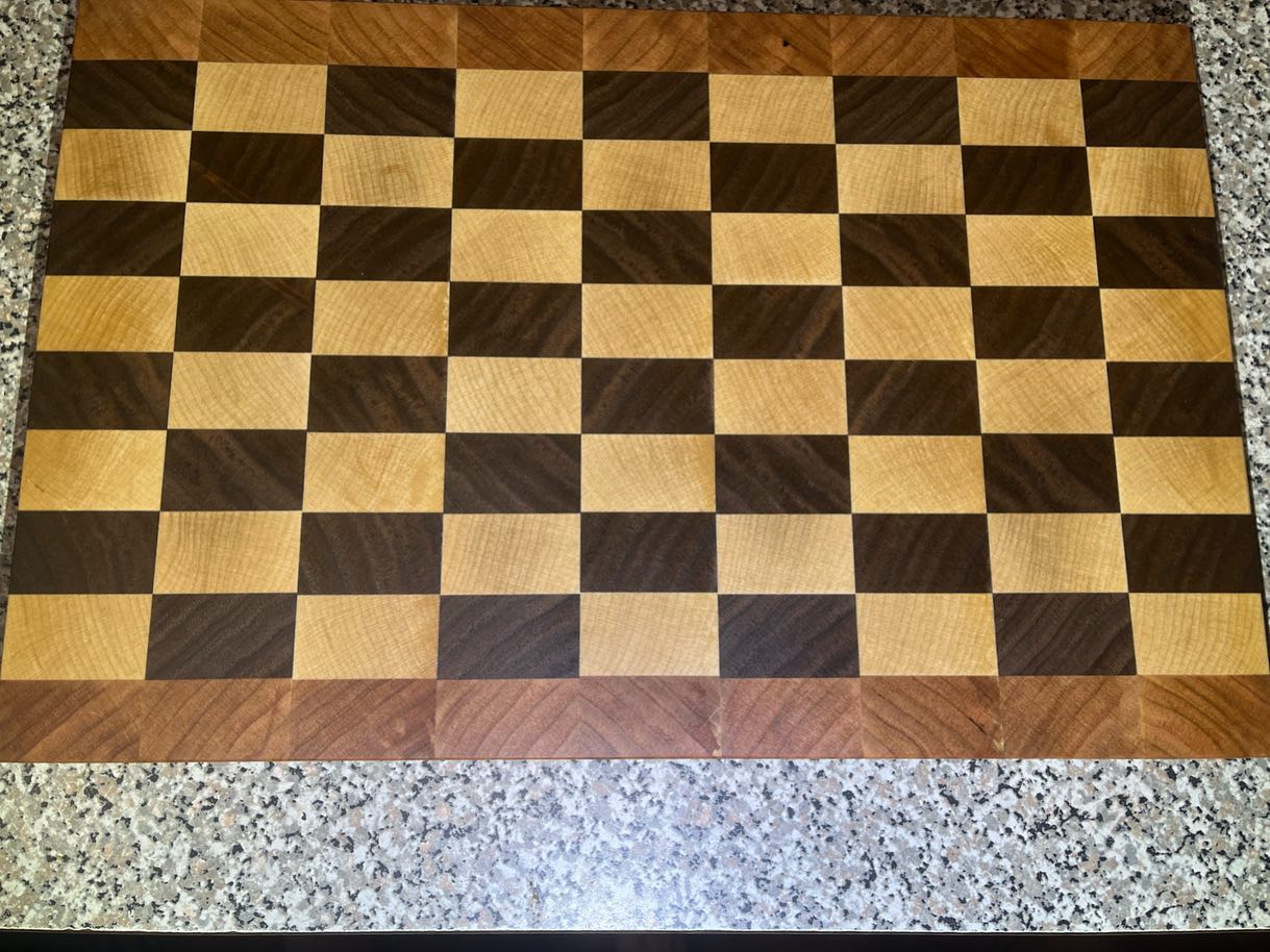 Checkerboard pattern End Grain - black walnut and maple squares with cherry exterior end grain strip. Sanding to baby smooth took forever !