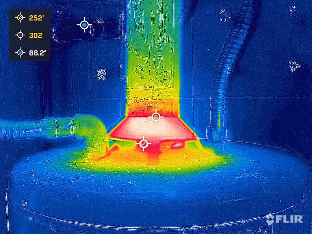 Backdraft! The water heater vent flue/draft hood was leaking, carbon monoxide and heat back into room. This was due to a damaged rain cap. Thermal shows excessive heat at hood and heater but no heat at flue. Things to look for without a thermal camera is melted plastic at the pipes due to heat. Condensation and rust at hood/heater. Some old timers use a mirror to check for condensation due to leaking exhaust.