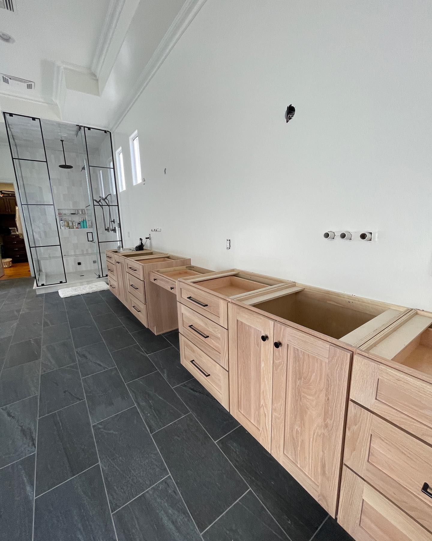 We can’t get enough of our new line of cabinetry! It’s custom cabinetry without the custom price tag! #customcabinets #customcabinetry #whiteoakcabinets #whiteoakcabinetry #mastervanity #furniturevanity #linencabinet #modernvanity #vanities #bathroomdesign #masterbathroom #masterbathroomremodel #jackandjillbathroom