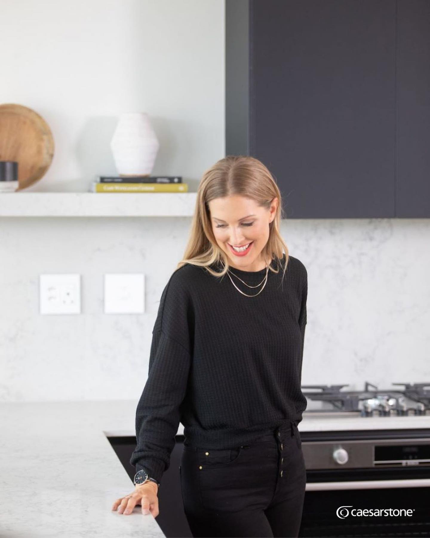 MOODY MONT BLANC
It’s hard to go wrong with a black and white colour palette. This combo suits almost every kitchen style from Modern Scandinavian, traditional, to chic & contemporary and provides an exciting and versatile base to play with a variety of textures and finishes.
We had the pleasure of working with creative director Jo from @thesourcinglab in creating this beautiful kitchen.
Our team at Rock & Stone installed Caesarstone Mont Blanc countertops with a high splash back and thick, custom open shelving in for an extra striking and elegant statement piece.
Caesarstone Mont Blanc features an exceptionally light grey, almost white base with natural, unique and dominant veining in varying darker grey hues.
Perfect for a strong contrast interior, in this kitchen the countertops have been paired with matte black joinery by Core Kitchen which compliments the dark veining in the stone. Rustic hardwood flooring brings an element of wood to this space and boasts fine details of dark feature knots in a deep charcoal hue which effortlessly pair with these gorgeous matte black cabinets.
All the dark elements are beautifully contrasted with Ceasarstone Mont Blanc and the light wall colour and wooden accents.
We are just in love with this look!
Be sure to check out Tips on How to get The Moody Kitchen Look with Caesarstone by checking out their video on YouTube. https://youtu.be/1Av8ckWiCyM
Great working with you @thesourcinglab @corekitchens @caesarstonesa