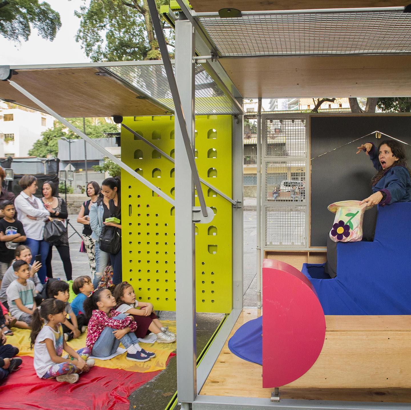 How much can a little box achieve in activating a public space with play?
We love this project by @incursionesve and @willsandydesign which aims to enhance social infrastructure, generating incidental engagement and opportunities for community events. This simple prefabricated box creates a framework for cultural activities, classes, children’s workshops, exhibitions and sports events. Working together with the British Council, the designers came up with a design which allows for multiple configurations and at just 6 sqm it is cleverly designed to be both highly adaptable but also specific for it’s purpose. The cube can be easily assembled and disassembled to move around where it is needed most.
.
Project: Catalyst Cube
Designers: @incursionesve @willsandydesign
Partners: @britishartsve
Location: Caracas, Venezuela
.
.
.
#citiesforplay #playfulcity #childfriendlycity #play #learningthroughplay #urbandesign #placemaking #publicspace #urbanplanning #citymaking #urbanchildhoods #citylife #urbanista #planning #citylab #citiesforpeople #playmatters