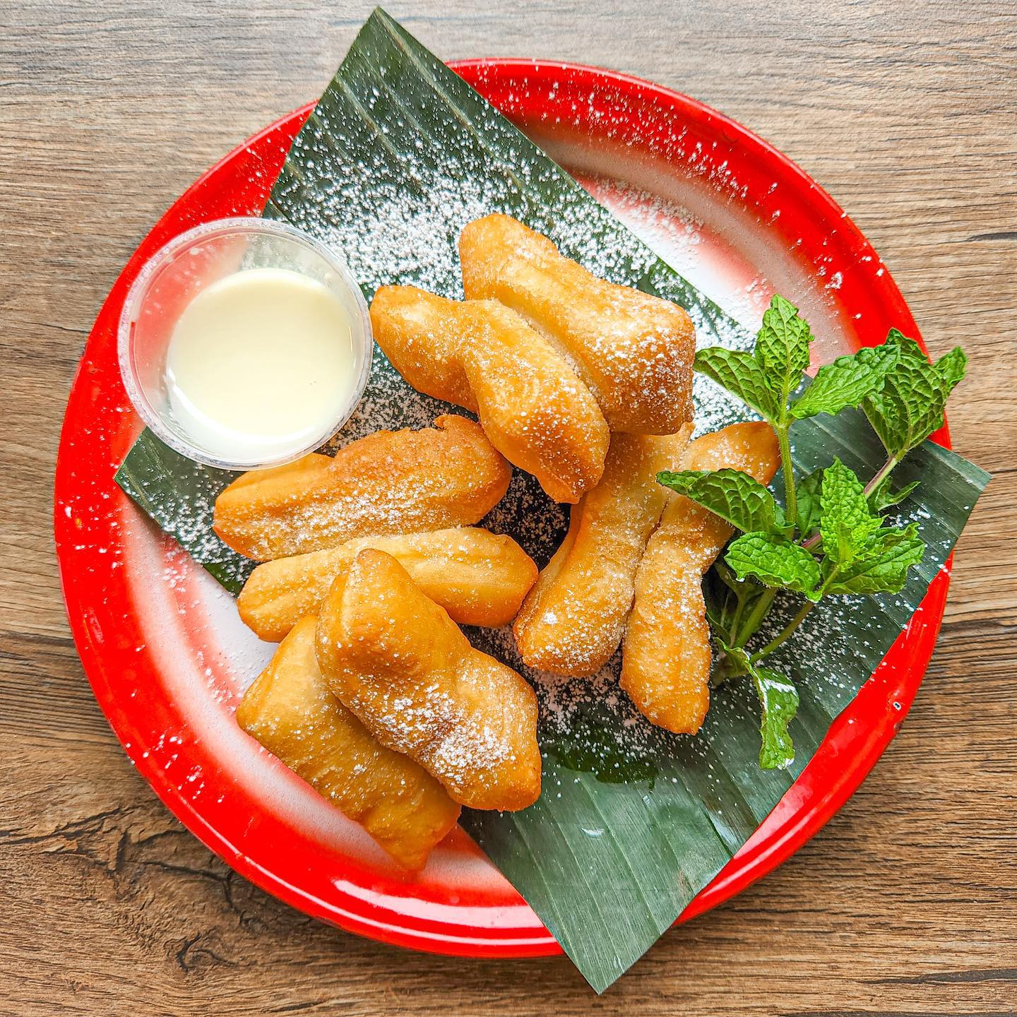 🥖 PATONGO DONUTS 🥖
Get them while they last! June’s dessert special is Mom’s idea for Patongo Donuts. Fluffy, lightly sweet donut sticks made from wheat flour and tapioca starch, dusted with powdered sugar and served with sweetened condensed milk icing for dippin’ or drizzlin’!
.
.
.
#milwaukeeeats #milwaukeerestaurants #sweetbasilmke #thaistreetfood #thaistreeteats #laofood #laofoodmovement #patongo #youtiao #asianstreetfood #foodpresentation #modernasianfood #dessertspecial #donutsofinstagram #dessertdate