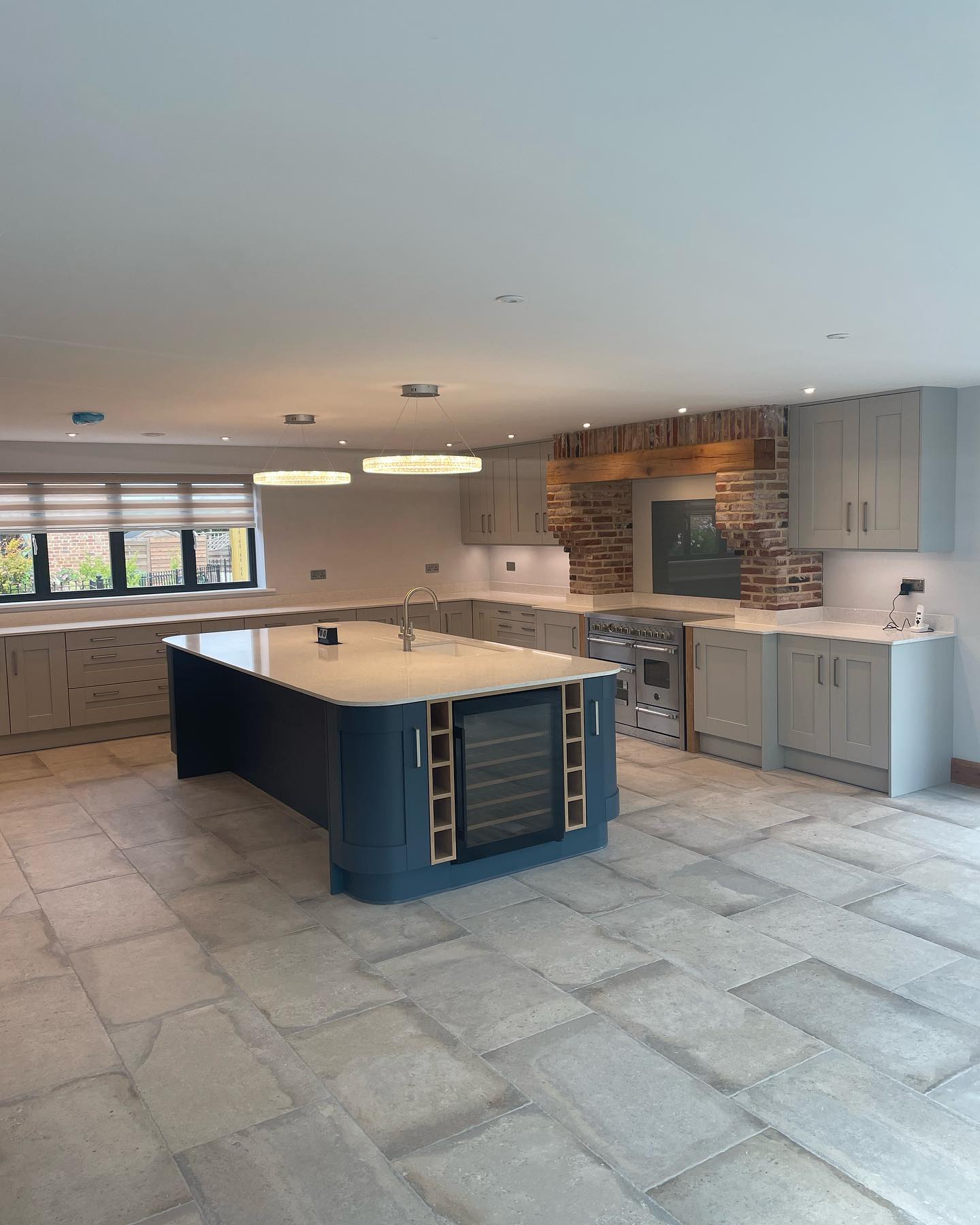 Project Barn Conversion.
We had the pleasure of suppling and installing this stunning kitchen in a very spacious barn conversion.
The Kitchen island is 3250mm x 1500mm wide, manufactured in one whole piece of quartz. They don’t come much bigger than that.
Dove grey & Navy blue buckingham doors from @trademouldings_rochdale
Worktops 20mm Stella Blanco from @silestonebycosentino
@bertazzoni_official 1100mm range cooker.
@thesbox pop up socket box.
@blanco_uk subline sink & candor tap.
@aeg.uk wine cooler 🍷
#kitchens #kitchendesign #barnconversion #kitchenproject #kitcheninspo #lightingdesign #barnconversions #quartz #kitchensofinsta #kitchensofinstagram #sbox #silestone #bertazzoniitalia #blanco #winecooler #kitchenislands #kitchenislanddesign #kitchenislandlighting #ashwoodkitchens #supplydesigninstall #AEG #oakbeams #farmlife #backbritishfarming