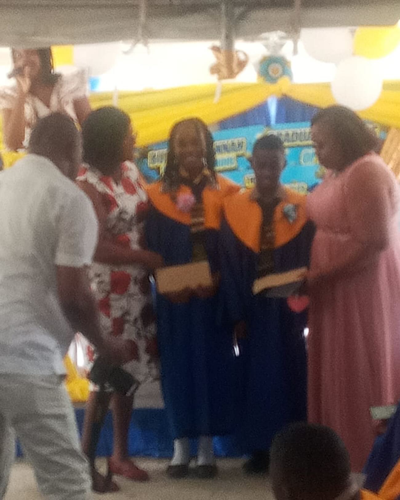 Members of “The Roy Thompson Foundation” (Mom and Sis) presenting Book Vouchers to the Top Boy and Girl at the Burnt Savannah Primary School Graduation Ceremony. #thefutureisnow #KidsaretheFuture
