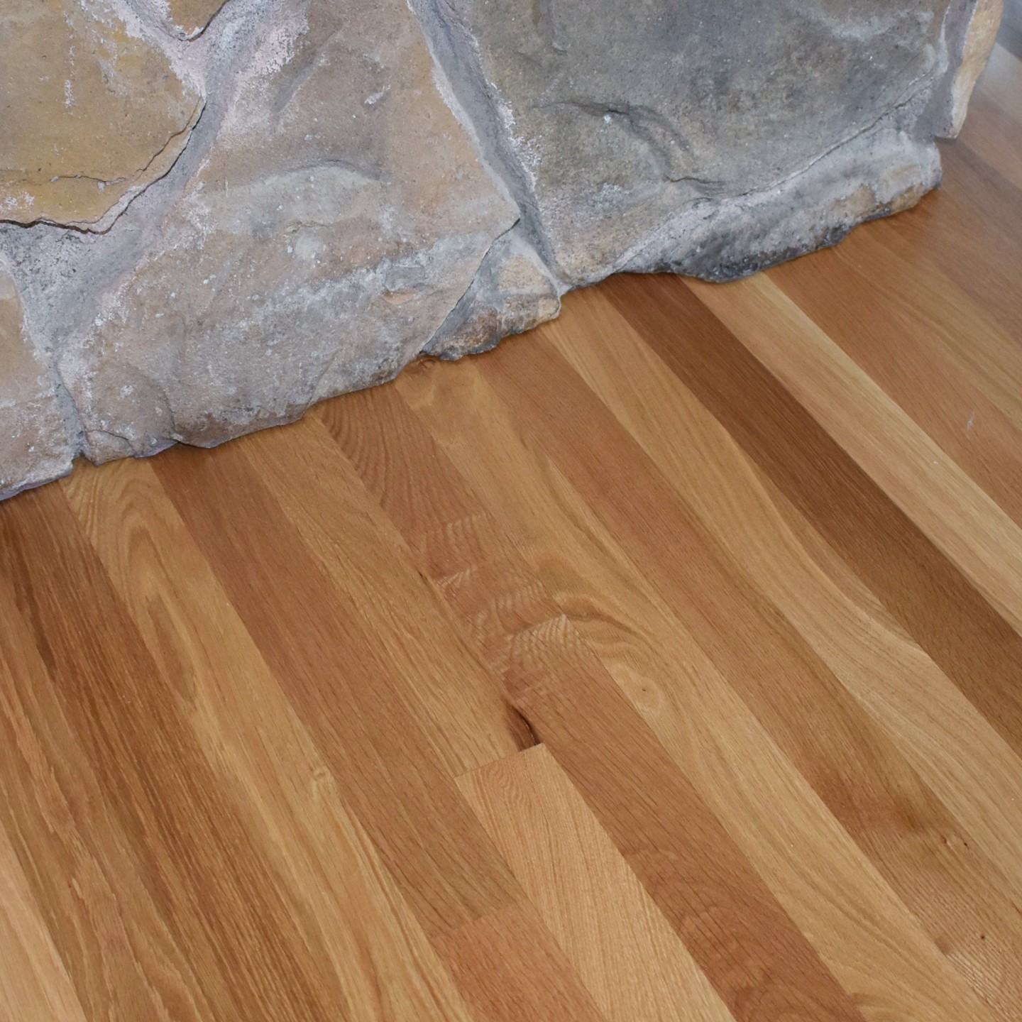 Here is a 2.25" Red Oak install we did that included some tile demolition. Whenever we install up to and around stone and brick structures such as fireplaces, we like to undercut in order to create a clean finished look leaving no gaps, grout or caulk.
#wooddesign #woodfloors #redoak #hardwoodfloors #woodworker #woodfloorbusiness #bellevue #carpentry #remodel