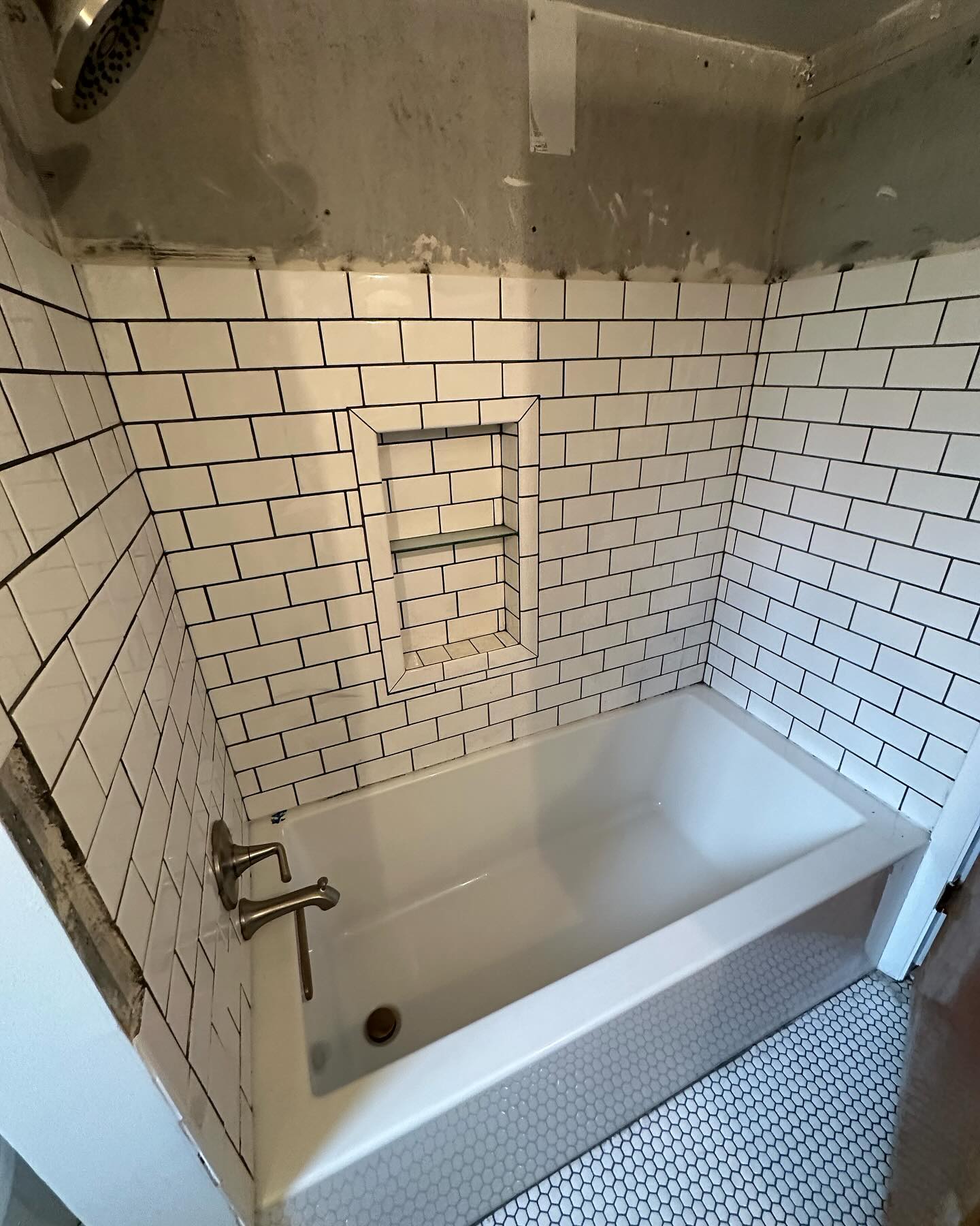 The contractor that is available right away VS the one you have to wait for! This customer had this guy in here for weeks to accomplish one of the worst bathroom “remodels” I have seen in recent memory. We came in and removed all the tile, cement board (walls and floor) and started over for them. Needless to say, they’re much happier with the current setup. I know it’s nice to get the bathroom done quick in the days of instant gratification. But sometimes, it’s worth it to wait for the right guys. It will also end up saving you over 50% since you won’t have to pay twice.
#remodel #kimbletile #tile #subwaytile #bathtub #tub #kohler #americanolean #tec #virginiatile #bathroom #bathroomremodel