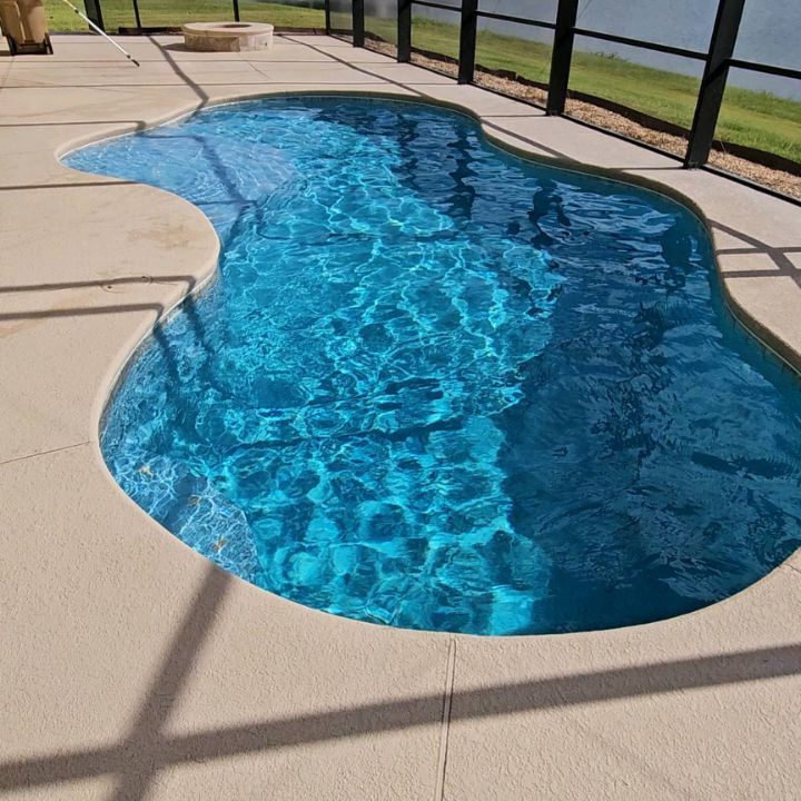 Beautiful St.Thomas Freestone Pebble Pool Finish on this Kissimmee Pool Home.