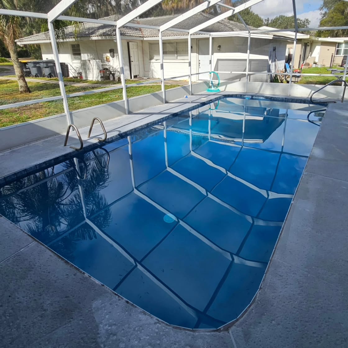 Antigua Blue Pebble Finish on this lake home, and 6" porcelain tiles to compliment with Grey grout. Ready for deck pavers in the coming months. Ground water on this one filling the pool up about 2ft high when utility pump was OFF, in order to prepare for surface we fit a hardline pump into the sump to keep pressure under the pool low, and reduce risk of popping.