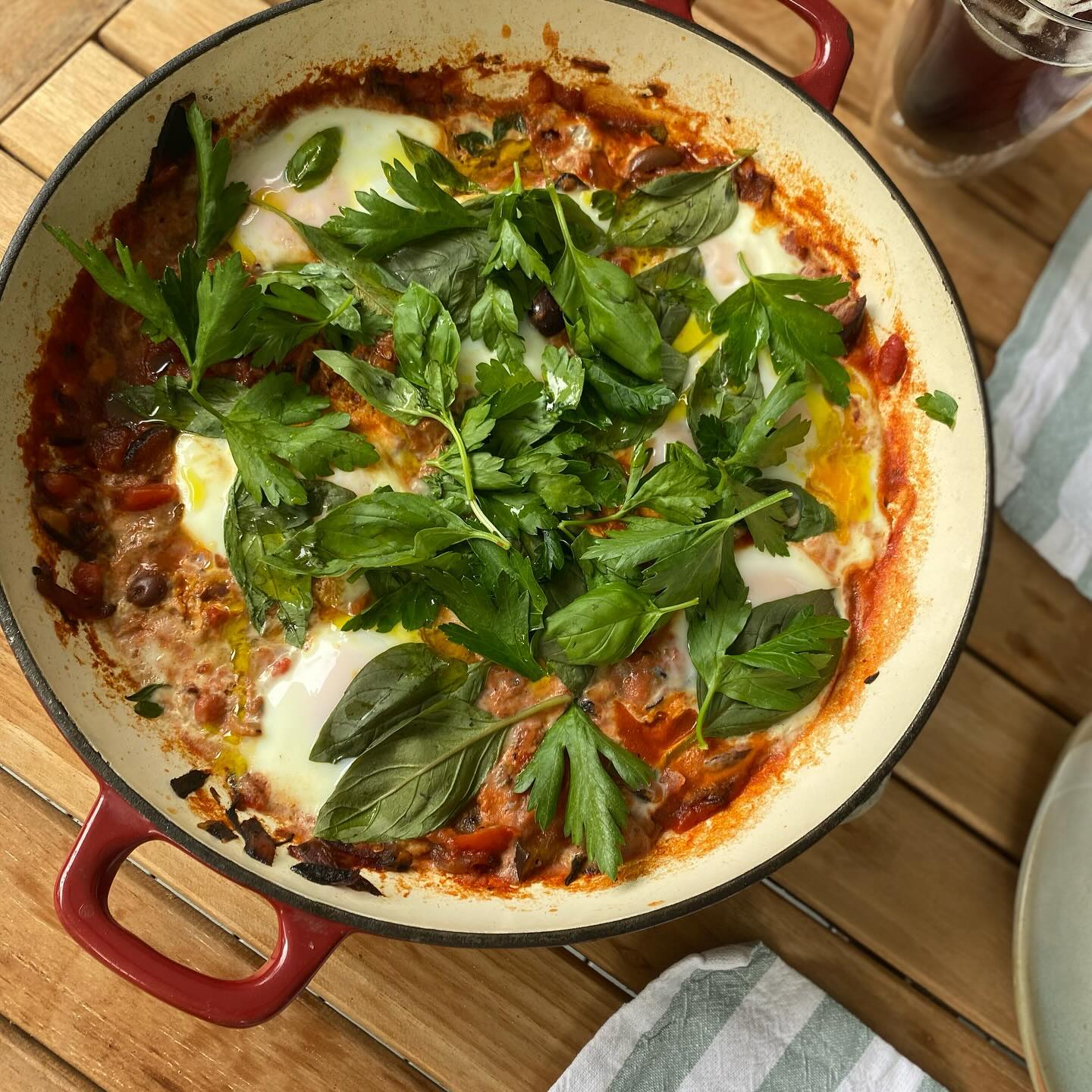 Healthy entertaining ft. BRUNCH 🍴✨
You want something that isn’t going to take you 5 years in the kitchen and leave you in a sweaty exhausted tornado but is delicious, nutritious + hopefully a little touch of impressive + delightful.
One of my favourite brunch options: SHAKSHUKA. This beautiful middle eastern dish is warming, nourishing, full of nutrients + creates a beautiful spectacle on the table.
You’ll need:
▻ 1/4 eggplant, loosely diced
▻ 1 can of diced tomatoes, (BPA-free / organic if available)
▻ A handful of olives (pipped + halved)
▻ 1/2 spanish onion, diced
▻ 8 eggs
▻ 1/2 red capsicum, loosely diced
▻ 2 bay leaves
▻ 1 tsp ground cumin
▻ 1 tsp ground paprika
▻ 1/2 tsp dry oregano
▻ Fresh basil leaves, to your taste (I used a generous handful)
▻ Fresh parsley leaves (as above)
▻ Salt + pepper to taste
Serve with (in separate bowls):
▻ 1-2 piece pp of your favourite sourdough or GF bread, to toast
▻ 1 avocado, sliced with lemon S+P
▻ Goats Cherve
▻ Hummus or tahini sauce
▻ Bacon (optional), nitrate free if possible, approx 8 pieces IE 2 per person
▻ Fresh mixed leaves or rocket in EVO + lemon or balsamic vinegar
Method:
✧ Cook onion + eggplant + capsicum in pan on medium heat, until brown
✧ Reduce heat, add tomatoes + bay leaves / cumin / paprika / fresh basil / S+P, simmer for 10-20 minutes
✧ Whilst simmering, in a separate pan add bacon to pan on high heat; rotate until lightly crispy or to your desired consistency
✧ When you are getting close to wanting your meal - make 8 little holes with a spoon in your pan + crack eggs into these
✧ Whilst eggs are cooking, toast your bread + serve up remaining side dishes (including your bacon)
✧ Leave on low heat until white is full firm + yolks are slightly soft but formed
✧ Sprinkle fresh parsley to serve
It’s a crowd pleaser!!! And is adapted easily to suit dietary restrictions / preferences 💕💕💕