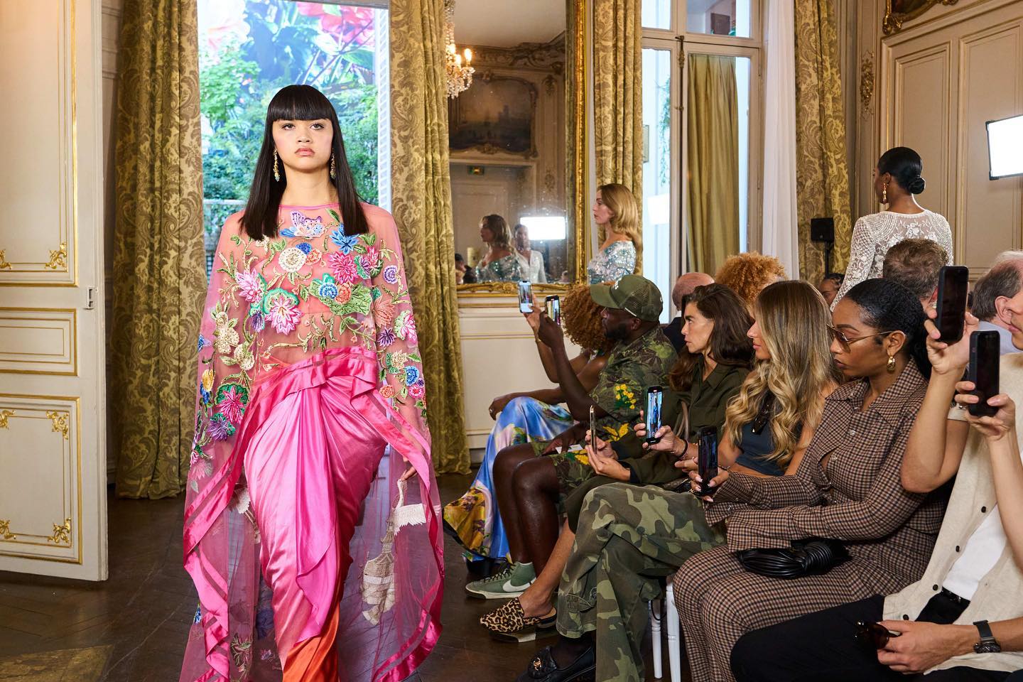 Elegance in motion: Where Parisian charm meets couture creations. #PFWrunway