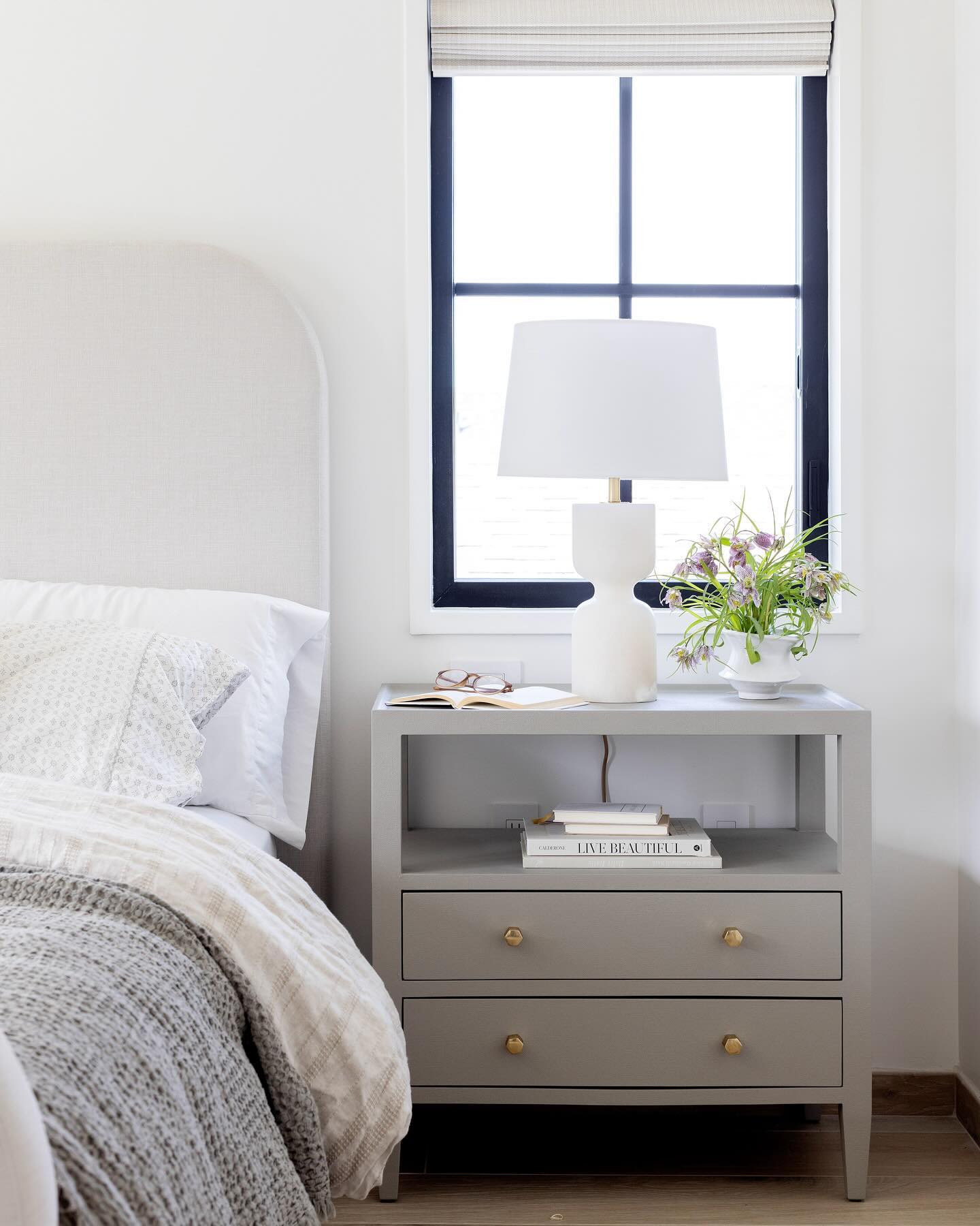 Custom bed, layered linens, fresh flowers and a book.
#interiorinspiration #bedroomdecor #vancouverinteriordesign