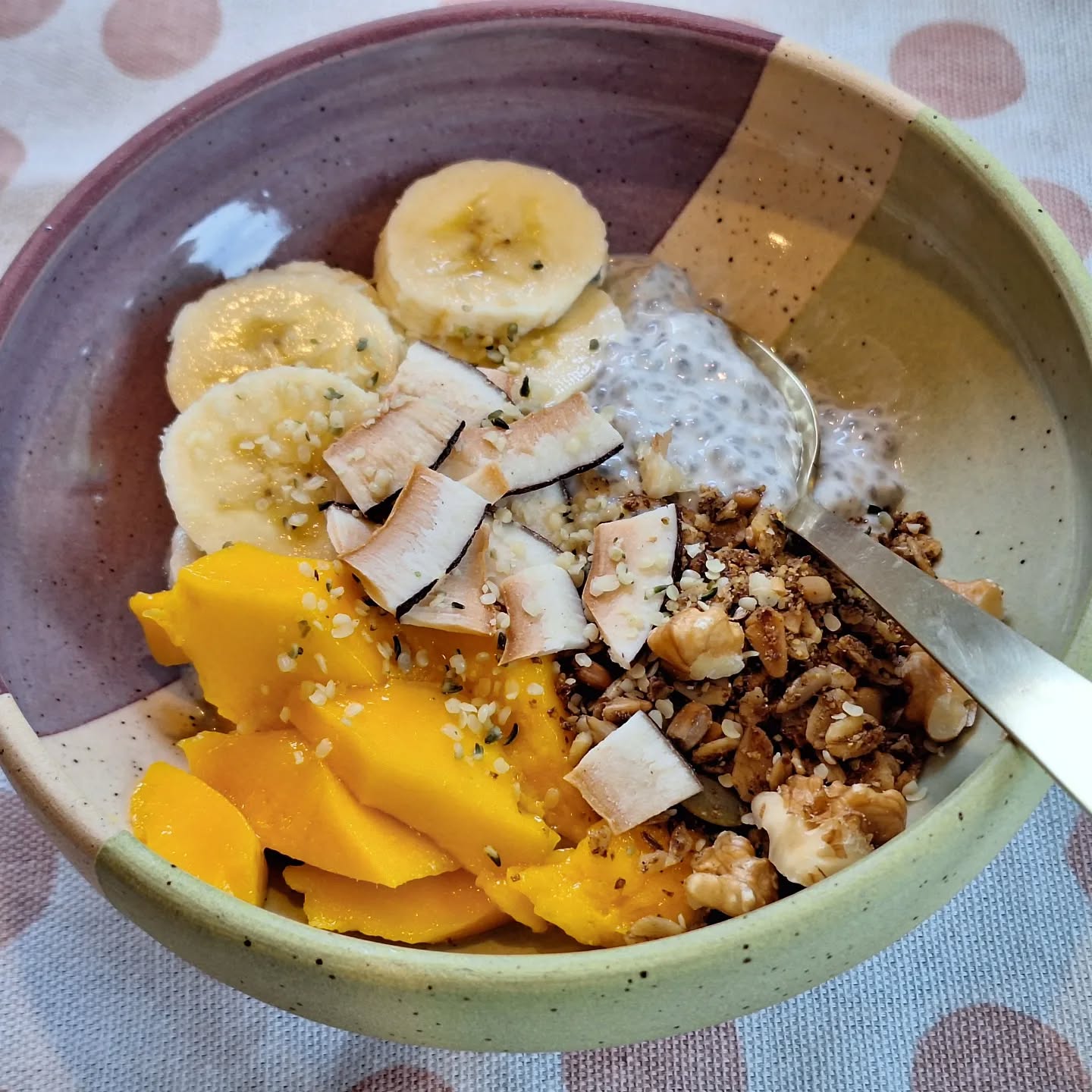 Tropical chia seed pudding is an easy breakfast you can make the night before, and it's ready to go in the morning. In a container, stir 1/2 cup plain kefir with 1Tbsp chia seeds, a dash of maple syrup, and a pinch of cinnamon. Stir well and let sit overnight. Top with banana, mango, granola, and coconut chips.