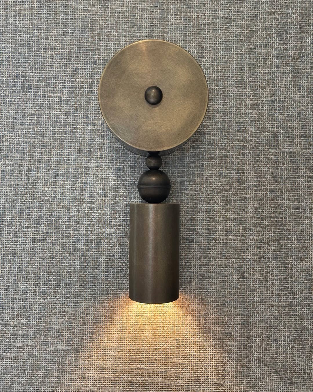 Sweet textured wall and sconce detail from our West Tisbury project. These hand made sculptural down lights are perfect for a media room #marthasvineyard #interiordesign #architecturaldesign #lightingdesign #residentialdesign #interiors #custombuilder @schumacher1889