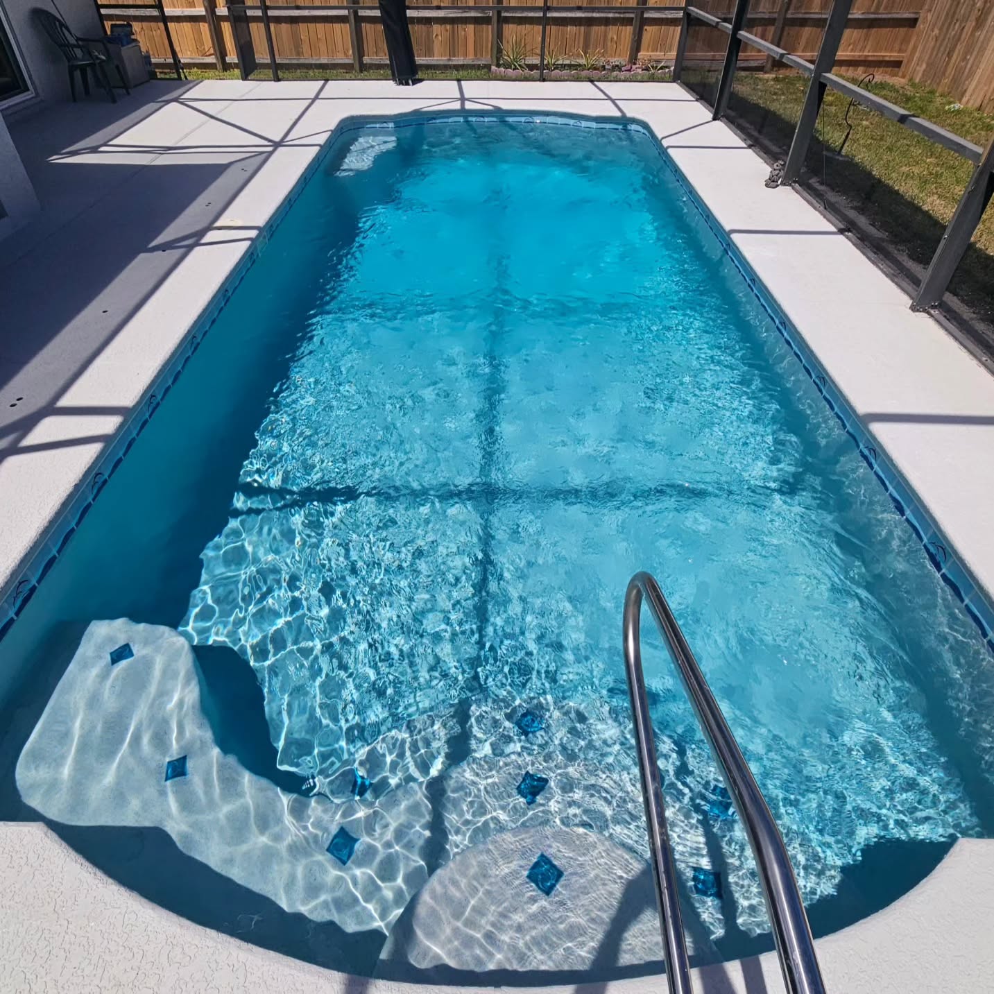 A little extra blue goes a long way. Extra blue quartz aggregates added into this Bluestone Mix to create this refreshing color for a swim.