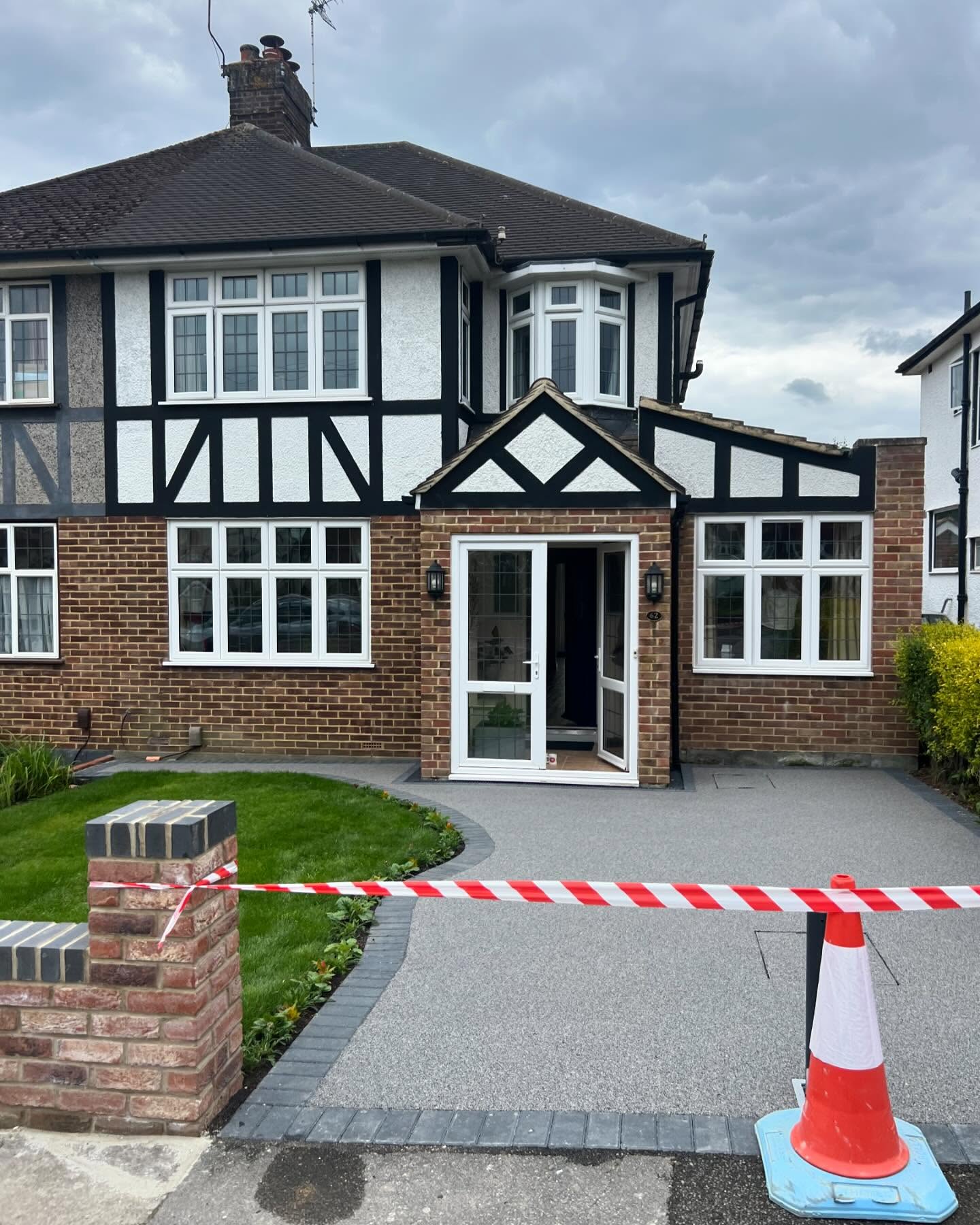 Resin bound (anthracite) plus new walling.