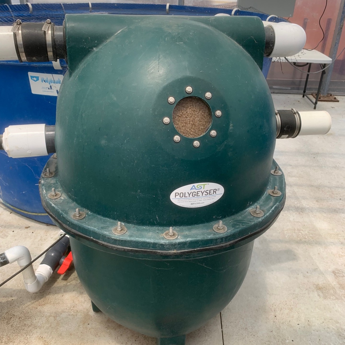 This is an AST PolyGeyser® Bead Filter. Its application is aquaponic wastewater. The media within the PolyGeyser works to reduce turbidity levels by capturing suspended solids - which produces clearer water. The beads act as a substrate for microorganisms to latch onto, removing ammonia and organic matter.